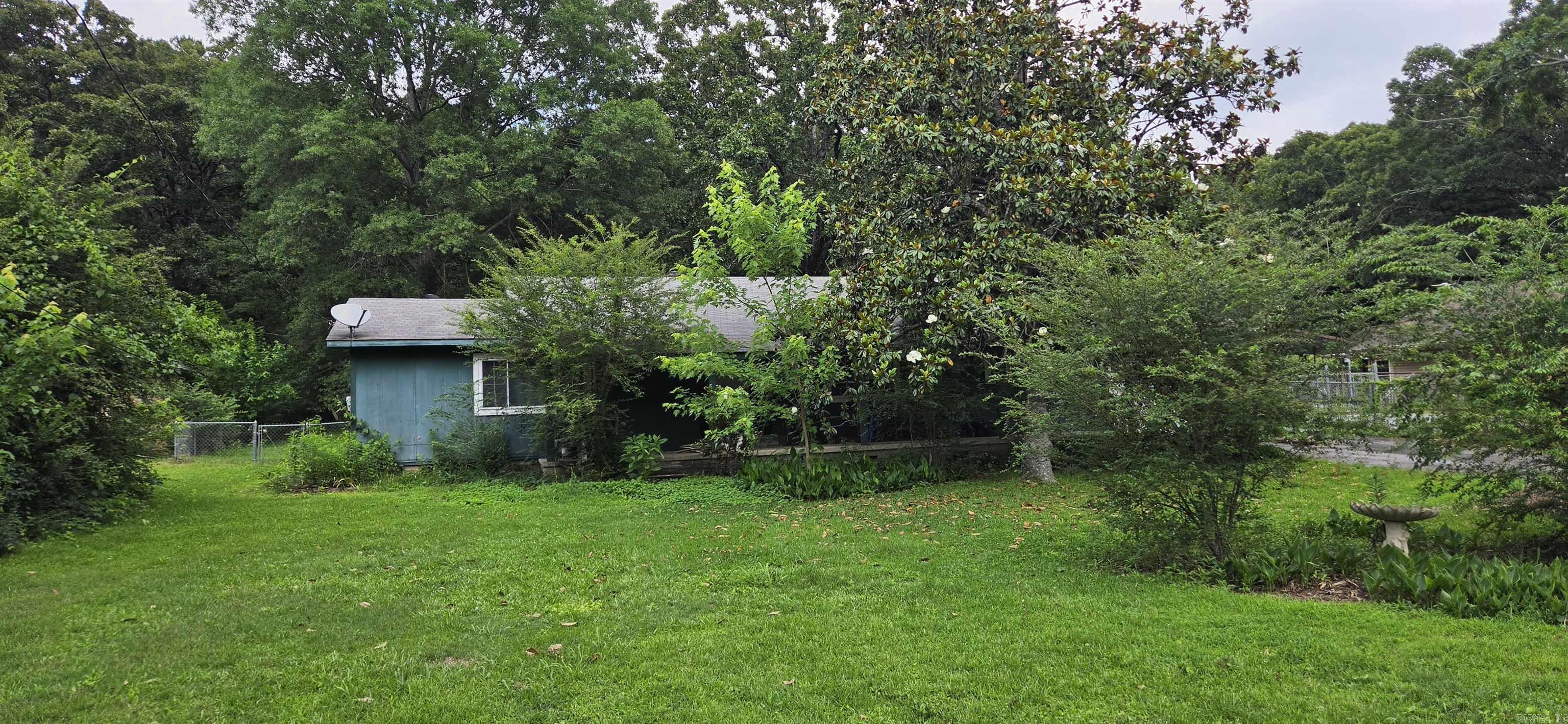 ! Enjoy country living on approximately +/- 1.5 acres while staying close to everything you need! Conveniently located with quick access to Interstate 40, North Little Rock, and Maumelle, this property offers the perfect blend of space and accessibility. The expansive yard provides plenty of room for kids, family gatherings, or even the addition of a great shop. Inside, you’ll find an open floor plan connecting the living area and kitchen, along with a large den that offers extra space to relax or entertain. With so much potential, this is an opportunity you won’t want to miss—schedule your showing ASAP! Sq. ft. aprox./Measuring encouraged. (Agents please see remarks)