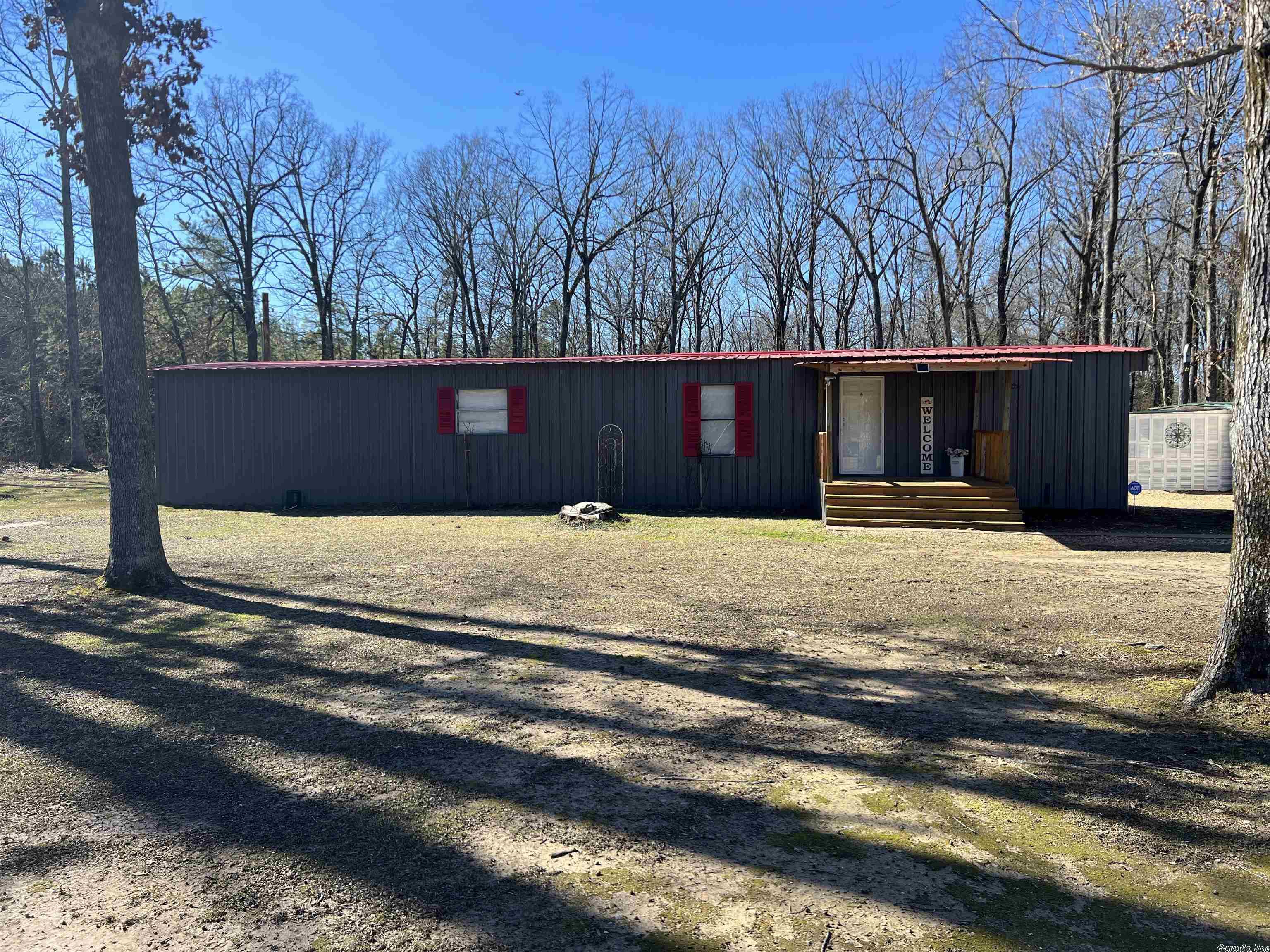 Adorable single wide mobile home with two beds and two baths on a little over two acres.  This home has a nice deck on back perfect for watching the deer and grilling out. Home is being sold AS-IS