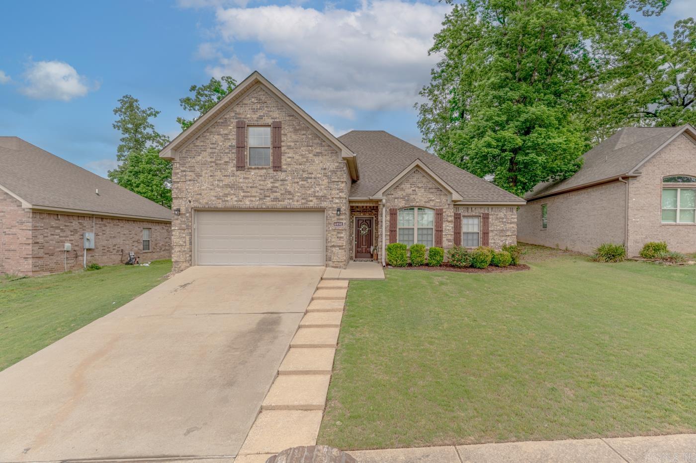 Schedule your showing now for this fantastic home located in peaceful Grace Village neighborhood.  You will appreciate the spacious living room perfect for entertaining and gatherings.  The Kitchen  features stainless appliances, granite countertops and abundance of storage.  The eat-in kitchen and breakfast bar make entertaining and meals a breeze! The home layout features split floor plan on the main level.  The master suite opens up into a private bath with double vanity, new shower, and his & her closets.  on the other side of the main level, there are two additional bedrooms with a bathroom.  Upstairs, a large bonus room is perfect for a fourth bedroom, game room or Office. Heading outside, the backyard is large, fully fenced, and includes a covered patio for making fun memories outdoor.