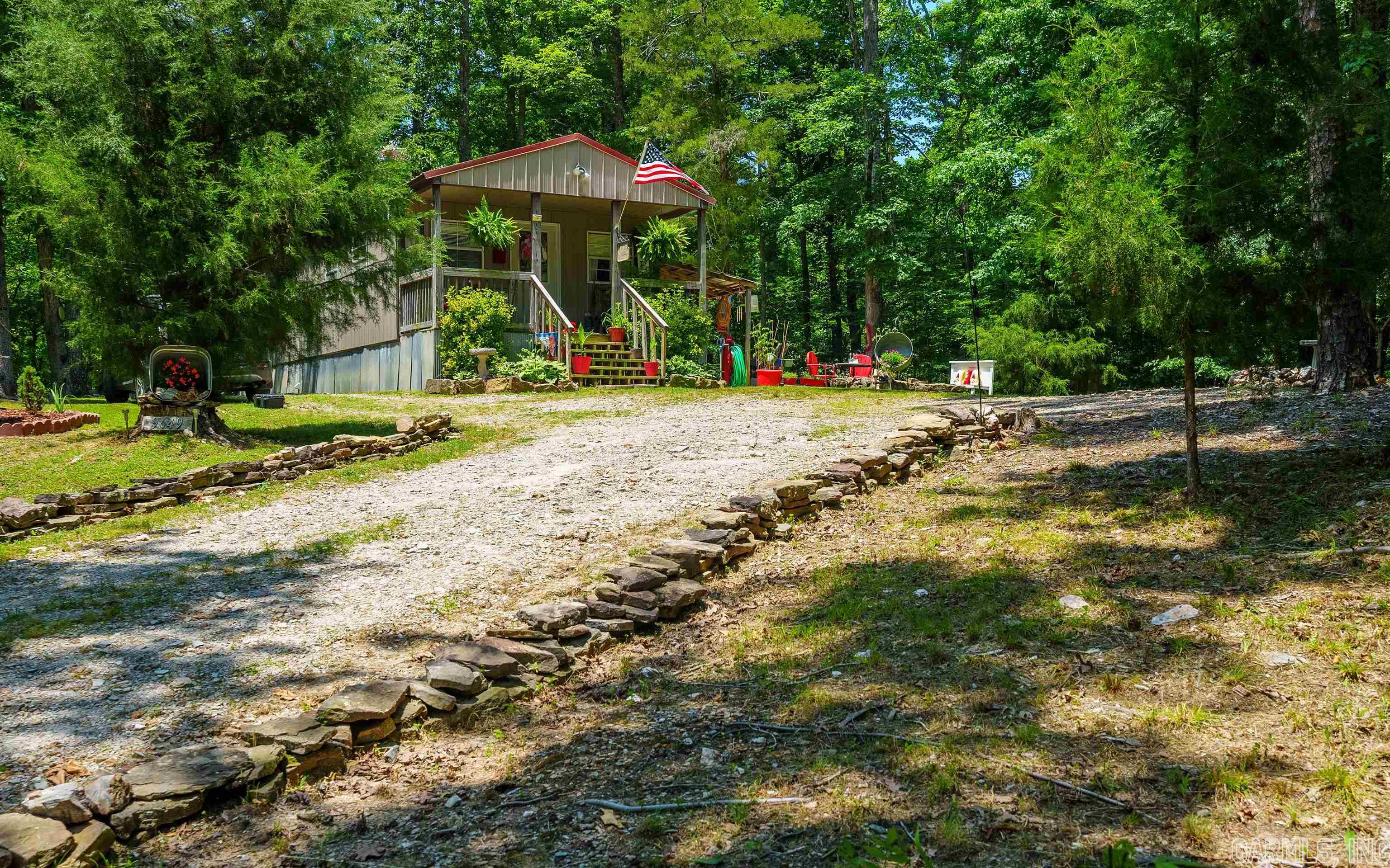 Adorable home in a country setting. This home sits on approx. 3.30 acres +/- Located close to Hot Springs, Hot Springs Village and Benton. 1 bedroom 1 bath home. Open living room and kitchen. Bath and Laundry in one room. Inside finishes are rustic with Yellow Pine walls and Tin ceilings. Great for Permanent home or AirB&B! SHOWINGS BY APPOINTMENT ONLY!