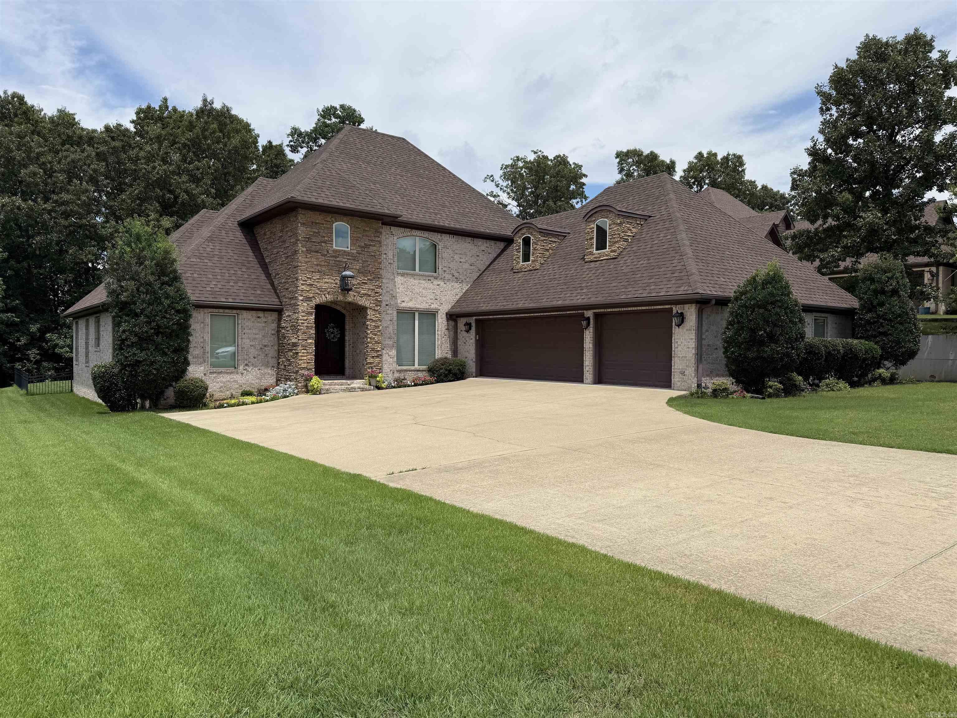 Beautiful custom built home on #15 Fairway in Sage Meadow with 5 bedrooms, 3.5 baths, 3600 sqft, 2 living areas, and a fenced in back yard. On the main level you will find acid stained concrete floors in the main areas and master suite, and new LVP flooring in the two additional bedrooms.  Upstairs you will also enjoy the new LVP flooring throughout.  The upstairs has two additional bedrooms as well as a second living area.  Off the laundry room is a large safe room for added peace of mind. Enjoy the community pool, tennis/pickleball courts, playground and clubhouse with a full restaurant.  Call today for more information or to schedule your private tour.