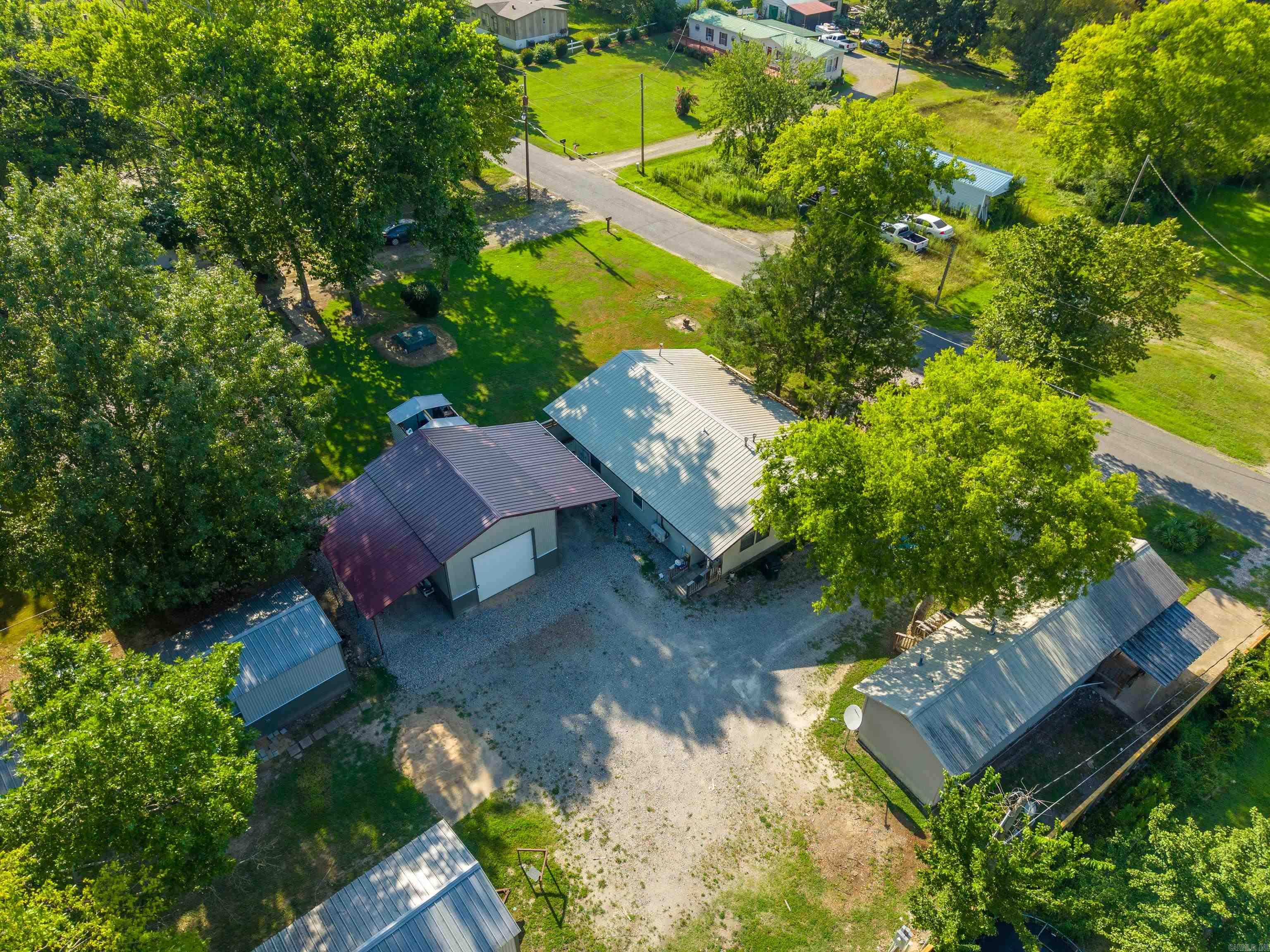 This is a fantastic opportunity to purchase your first multi-family property or expand your investment portfolio with a strong income-producing package. The property includes 1 duplex, 3 mobile homes and a large shop with covered areas that offer additional storage and/or rental income potential. With estimated potential rental income of approximately $5,600 per month, this property presents excellent cash flow opportunities. Four of the five units have been renovated, adding value and increasing tenant appeal. The property is partially fenced and features a mix of 1- and 2-bedroom units in a convenient location within walking distance to Dollar General and Harps Grocery. Situated in the highly sought-after Lakeside School District, this property is an outstanding investment opportunity with established income, added amenities, and room for continued growth.