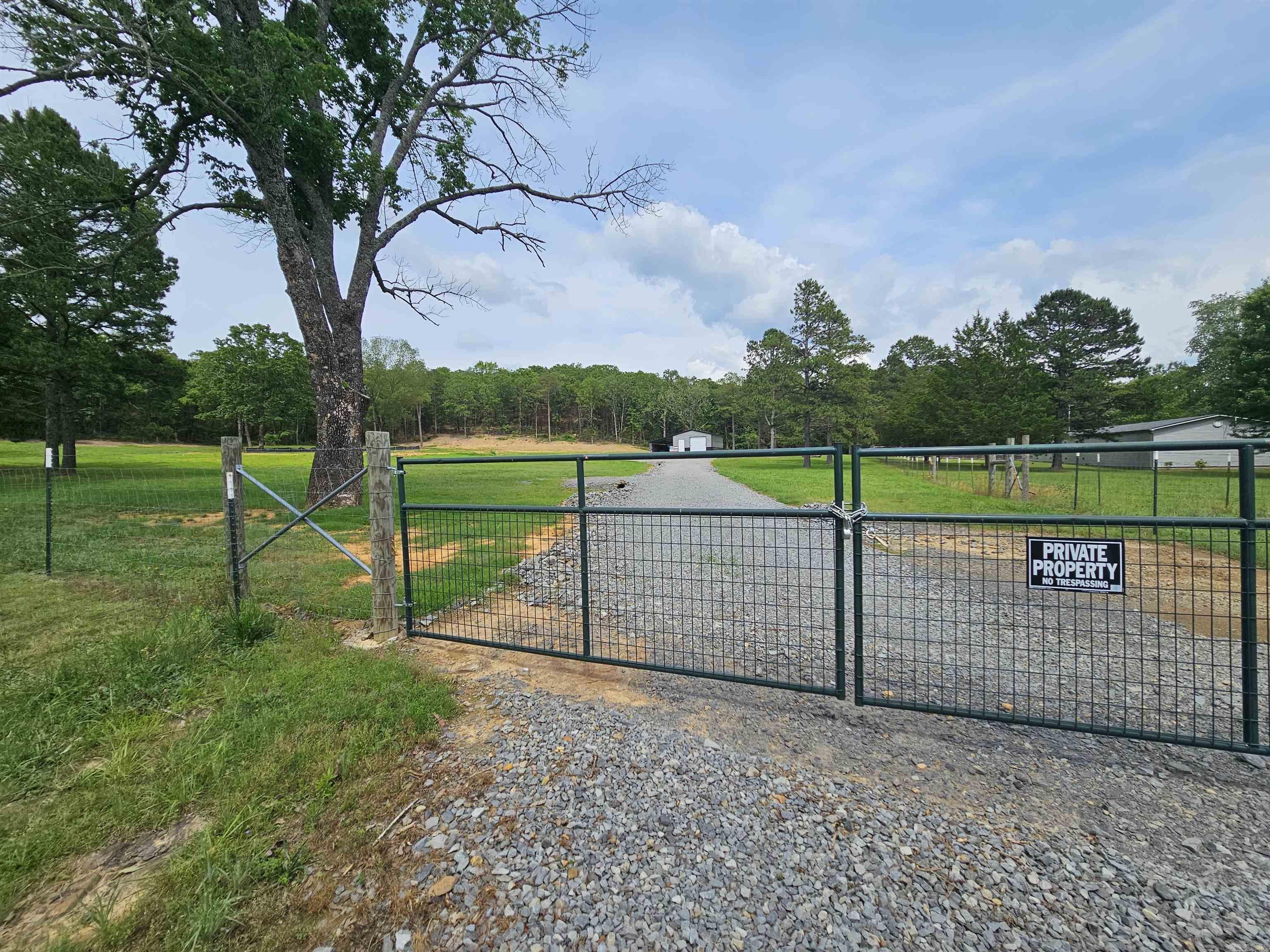 YOU JUST FOUND YOUR DREAM LAND! This beautiful property has had all the work done for you! Drive through the private gate to find a custom built driveway leading up to the brand new metal shop with concrete floors and a side carport attached. A new pond has been built and is spring fed! Stock it up and enjoy it for years. A pad has also been built to start your dream home! This is the perfect land and the perfect location being on 15 minutes to Clinton and Greenbrier. Bring your floor plans and make this your homestead!