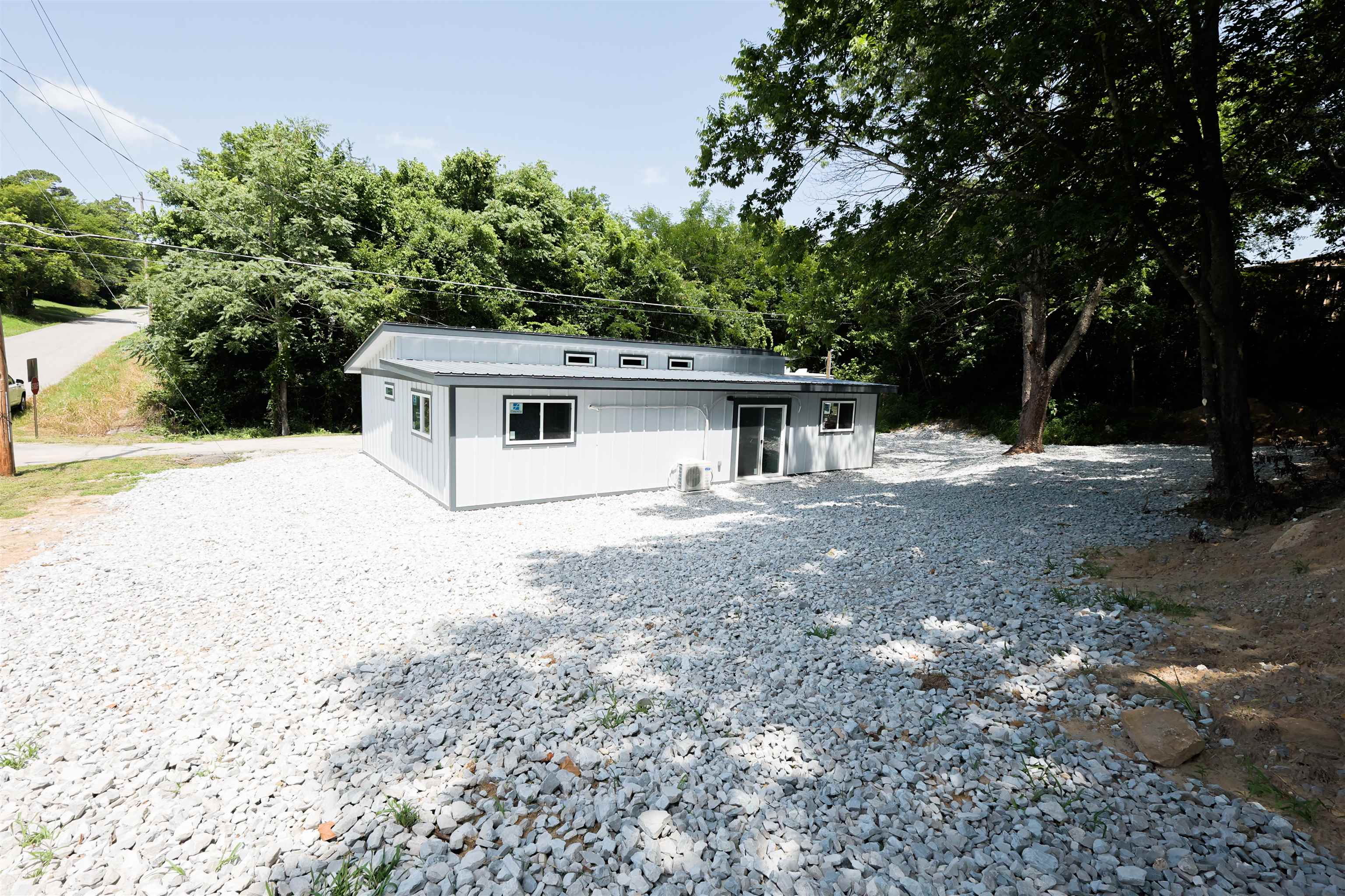 Located at 53 W Court Street in Melbourne, Arkansas, this newly built 2026 home offers modern, low-maintenance living in the center of town. Situated beside the historic Izard County Courthouse, this 2-bedroom, 2-bathroom home provides a convenient location near local businesses, schools, dining, and other Melbourne amenities. The home features an open-concept floor plan with a spacious living area, modern kitchen, and large laundry room. New stainless steel kitchen appliances convey with the sale, along with the washer and dryer. Designed with energy efficiency in mind, the home includes three mini-split heating and cooling systems, offering year-round comfort and efficient utility use. Situated on approximately 0.25 acres, this in-town property offers a practical layout with new construction features and minimal upkeep. Whether you are looking for a primary residence, retirement home, investment property, or low-maintenance home in North Central Arkansas, this Melbourne, AR property is well-positioned for a variety of buyers. Offered at $159,000.