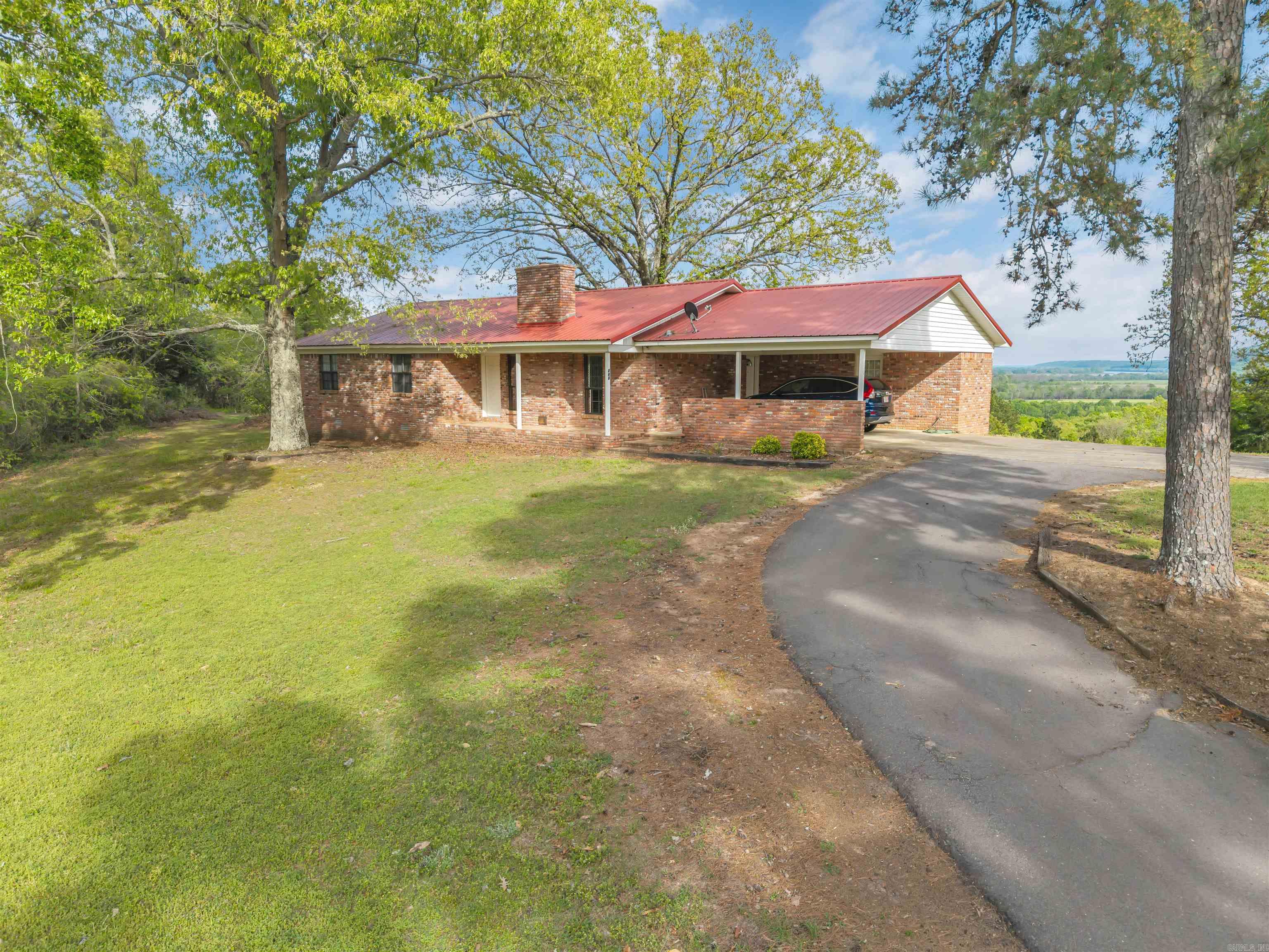 Located within the city limits of Bigelow, this property offers the perfect blend of convenience and quiet country feel. From the moment you pull in on the paved driveway, you’ll notice the well-maintained yard and inviting curb appeal. Inside, the home features 3 bedrooms and 2 bathrooms, with a spacious kitchen and a large living area centered around a beautiful wood-burning fireplace—perfect for gathering and relaxing. An enclosed room off the dining area and carport adds valuable flexibility, ideal for pantry storage, a hobby space, or whatever fits your needs. Out back is where this property truly shines. The porch provides the perfect spot to unwind at the end of the day while taking in sweeping views of the Arkansas River Valley. Fiber internet is available through Connect2First, giving you the best of both worlds—scenic living with modern connectivity.