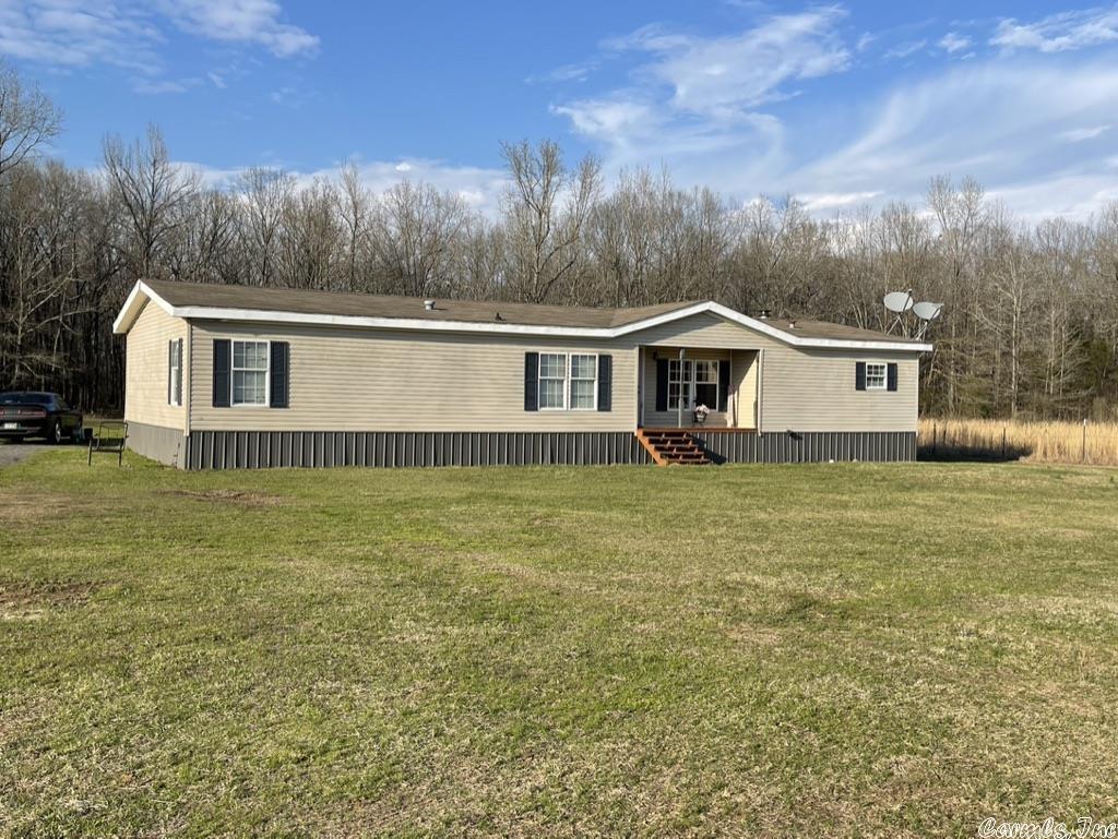 Country living at it's finest! COMPLETELY REMODELED IN 2021!  Open concept with a rustic country farmhouse feel! This home is cedar trimmed and has new luxury vinyl plank flooring throughout with all fresh paint! Comes with kitchen appliances! Kitchen offers beautiful wood topped island, tons of cabinets and pantry! Separate laundry room near the huge master bedroom! Enjoy the evenings by the wood burning fireplace in the great room with vaulted ceiling! New front and back doors, new oven hood fan, new HVAC in 2021, new windows, new ceiling fans, new light fixtures, new toilets and is all newly insulated!! Centrally located between Jacksonville, Cabot, Conway, Mayflower, Sherwood and Vilonia! Very private location at the end of the road! Across from Camp Robinson! 3.76 acres with a storage building out back and large back deck! You'll LOVE it!!!!!