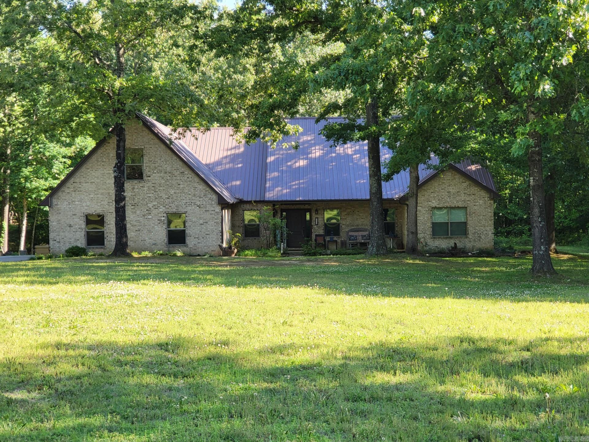 Welcome to 852 County Road 360! Nestled on approximately 1.50 acres +/- surrounded by mature trees, this 4-bedroom, 3-bath home offers the perfect blend of comfort, functionality, and peaceful country living. The open-concept layout connects the kitchen, dining, and living spaces for easy entertaining and everyday living.  The main level features 3 bedrooms, including a king-size primary suite with an oversized closet and spa-like bath complete with a corner tub, tile shower for two, and additional rain head. A dedicated office adds flexible space for work or hobbies, while upstairs offers a 4th bedroom or bonus room. The large laundry room includes a doggy shower that could be converted to a mudroom shower.  Additional features include a gas log fireplace, two HVAC units, two electric water heaters, a new oversized 8-foot garage door, and room to build a future workshop. Outside, the garden area is ready for the next owner’s harvest plans. Schedule your private tour today!