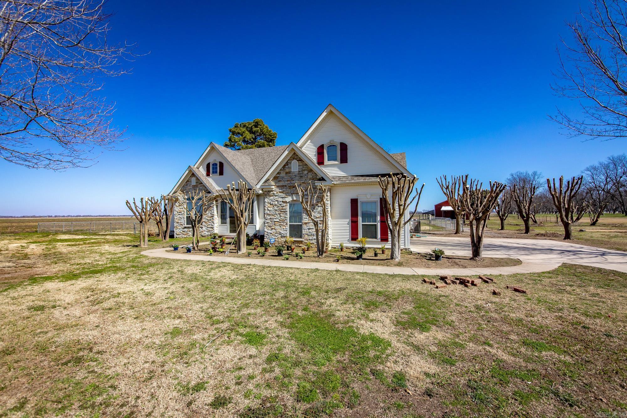 This is a custom-built home on 5.75 acres.  Neoclassical in style, it has bright open style with beautiful windows and arched interior doors.  It contains 3 bedrooms, 2.5 baths, Formal dining, kitchen and great room.  Upstairs you will find flex space for game room, hobby room or whatever you want.  Enclosed Porch, Sunroom, and Wood Deck. Outside you find a pasture and insulated barn.  Anxious to show this beautiful home.
