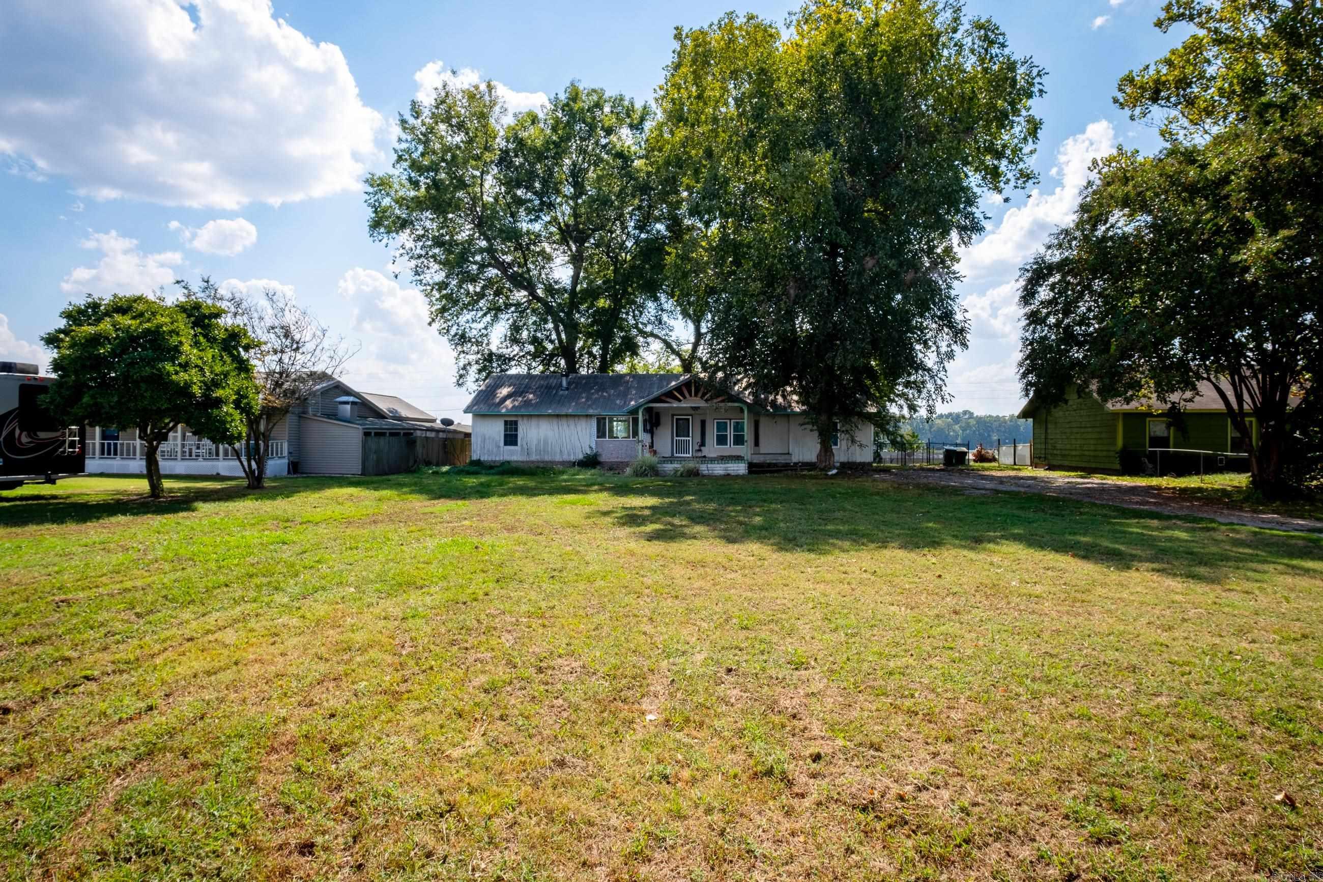 Charming Riverfront Mobile Home on Half-Acre Lot   Welcome to your serene riverside retreat! This mobile home is nestled on a generous half-acre lot, offering a picturesque view of the tranquil Old River. With its own private dock, this property is a water lover's dream come true.  Key Features: *Breathtaking River View: Wake up to the soothing sights and sounds of the river every day. *Private Dock: Enjoy easy access to boating, fishing, and water activities from your very own dock. *Spacious Half-Acre Lot: Plenty of room for gardening, outdoor gatherings, and more. *Flat and Beautiful Land: Perfect for outdoor enthusiasts and nature lovers. *Serenity and Seclusion: Escape the hustle and bustle while being just a short drive from town.  Whether you're looking for a peaceful weekend getaway or a permanent waterside residence, this property offers the ideal combination of natural beauty and convenience. Don't miss the chance to make this riverfront gem your own!  Home is being sold as is- needs some TLC