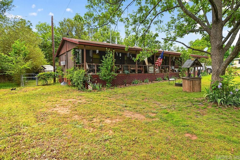 Attractive 4/1 Manufactured home on .34 acres near Clinton, Arkansas.   This single wide mobile received a permanent roof and 8'x60' covered front porch, plus an additional 1100 square feet of living area.  Wood siding was added to add to the appearance of the home.  An above ground pool in the backyard can help make summers fun, plus this home is only two miles to Choctaw State Park and Marina on beautiful Greers Ferry Lake, where you can enjoy boating, fishing, camping and swimming and more.    This home is priced to sell so call today to schedule a time to view this home in person.      Priced to sell so call the listing agent for an appointment to view this home in person.