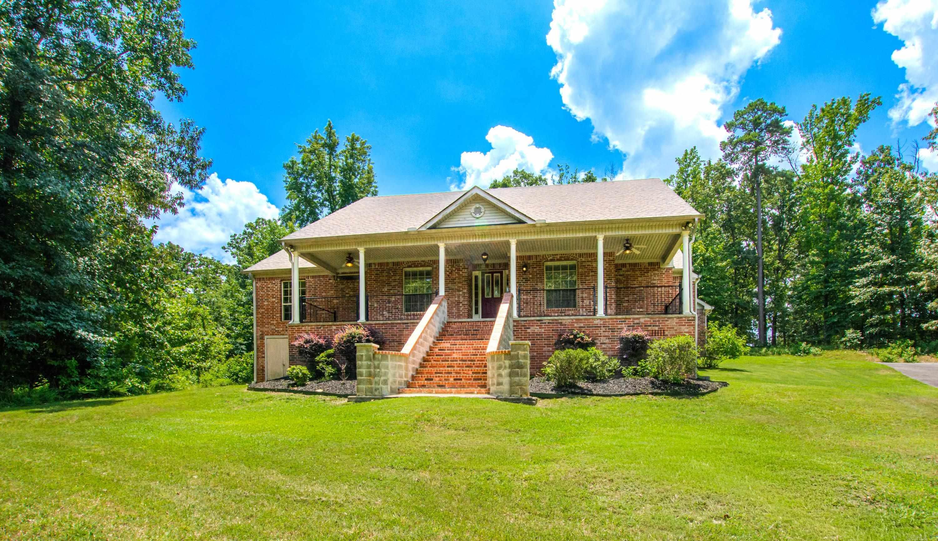 This stunning three-bedroom, two-and-a-half-bathroom home is nestled on a cul-de-sac in Benton, spanning an impressive 2.45 acres. The open floor plan includes a cozy breakfast nook, a formal dining room, and a spacious pantry. The living area boasts vaulted ceilings adorned with a fireplace, adding to the grandeur of the home. A large front porch provides a welcoming space to enjoy the outdoors. Behind the house, a family of deer resides in the nearby woods. The primary suite is a luxurious retreat, featuring two vanities, a walk-in shower, and a jacuzzi tub.