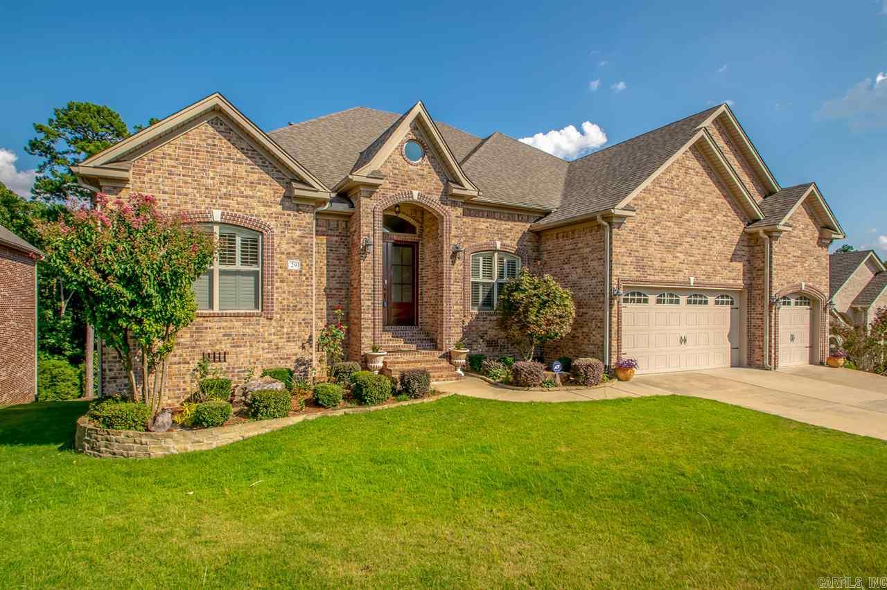 Fabulous well-built home in super desirable neighborhood! 2 living areas in main level; beautiful distressed hardwood floor throughout; Large kitchen with island, breakfast bar, granite counter tops, gorgeous wood cabinets and ss appliances; Spacious master suite with walk-in closets, luxury whirlpool tub, over sized his/her sinks; Downstairs has bonus area w/bar or third living area; Crown molding everywhere; Plantation shutters; High ceiling; Tankless hot water heater; Double-deck overlook green space!