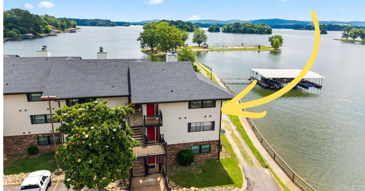 Lake views abound - wake up to some of the best views of Lake Hamilton from your bedroom, enjoy sunset on the water from your private patio, and take part in the incredible amenities Emerald Isle has to offer! All with some of the lowest HOA dues on Lake Hamilton. HOA now allowing short-term rentals! This thoughtfully updated condo stands out from the rest, with it's gorgeous luxury finishes. Fully renovated, fully furnished, and ready for you to enjoy. Amenities at Emerald Isle include the unique private peninsula, which has tennis, mini gold, a private beach, and basketball. A dog run and grill area offers more outdoor entertainment space next to the renovated pool and hot tub area. This community is truly special. Boat dock available for separate purchase.