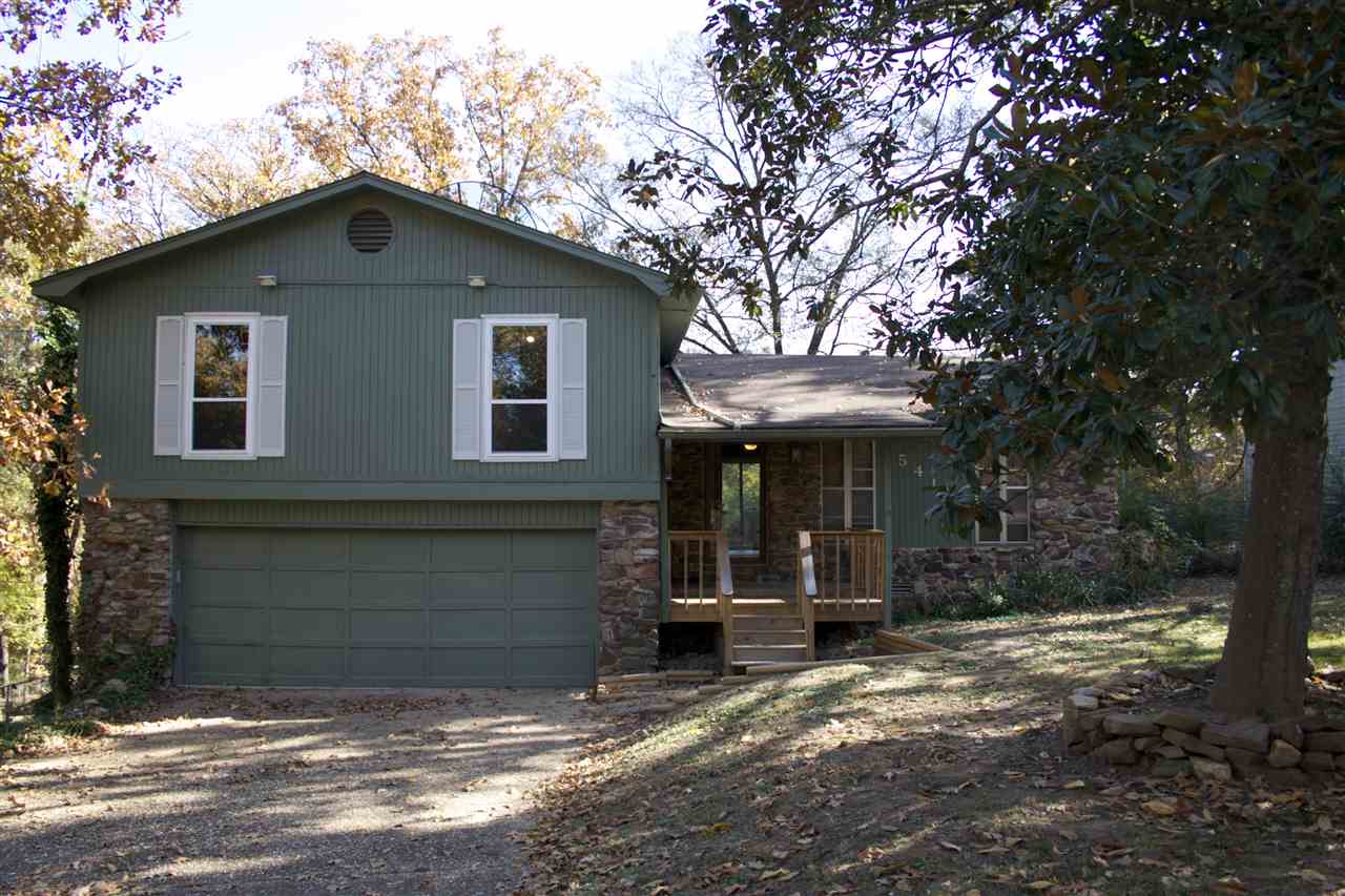 Come tour this extensively remodeled family home in desirable Western Hills subdivision! Just a few minutes drive from local shopping, dining, and nightlife. Nestled between wooded golf courses, this home boasts a spacious living area complete with refinished hardwoods and a fireplace, open floor plan leads into dining/kitchen with natural light from doors leading out to a large back deck. New landscaping, front porch, updated baths/kitchen, and BRAND NEW HVAC just installed. Call to schedule your showing!