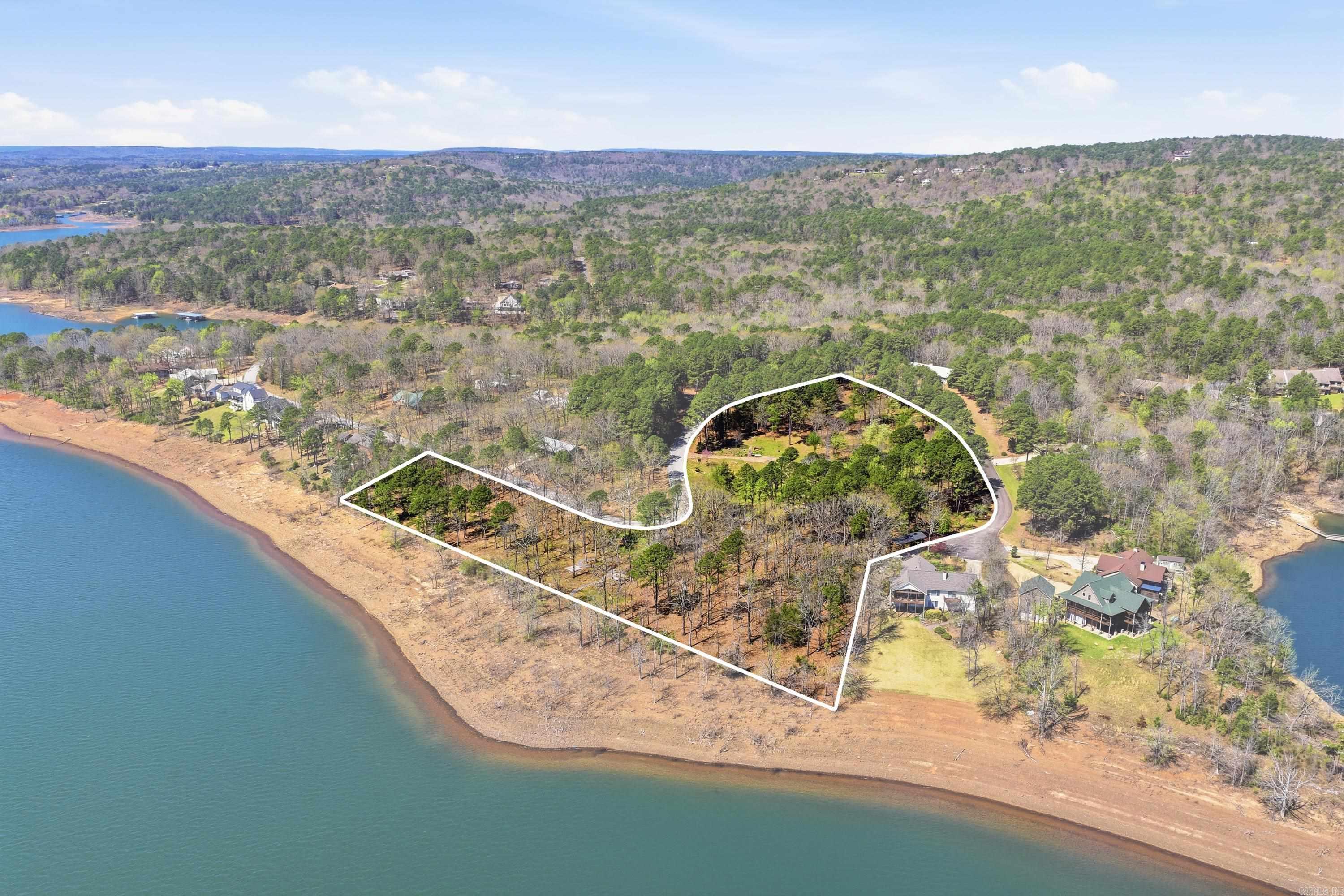 Don’t miss this rare opportunity to own a premium lakefront lot in The Preserve at the Bay subdivision of Fairfield Bay! This lot has a low white line and gentle slope to the water—imagine waking each morning to breathtaking water views & enjoying the peace & privacy this unmatched location offers. Perfectly positioned with a low white line to maximize your gorgeous, unobstructed lake views. Enjoy all Fairfield Bay Has to Offer: Hamilton Cove Pool is just a short walk away. Championship Golf: Two 18-hole courses just minutes away. Active Lifestyle: Pickleball, tennis courts, and more than 80 miles of ATV/UTV trails. Full-Service Marina, Swim, hike, bike, & so much more. Fairfield Bay truly is a slice of paradise! Build your forever home or a serene getaway in a welcoming, upscale neighborhood. This is your chance to experience lakefront living at its finest—where tranquility & recreation meet luxury and convenience. Paradise is calling.  See Agent Remarks