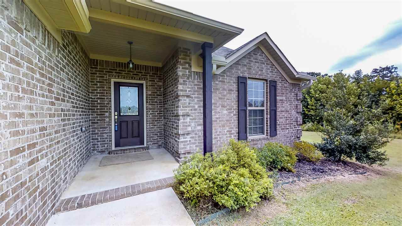 Just Like New!  This split floor plan home has been updated with new carpet and new waterproof flooring throughout.  Custom stained cabinets, granite countertops and corner gas log fireplace are some of its other great features.  All of this on almost an acre!  Call to see it today!
