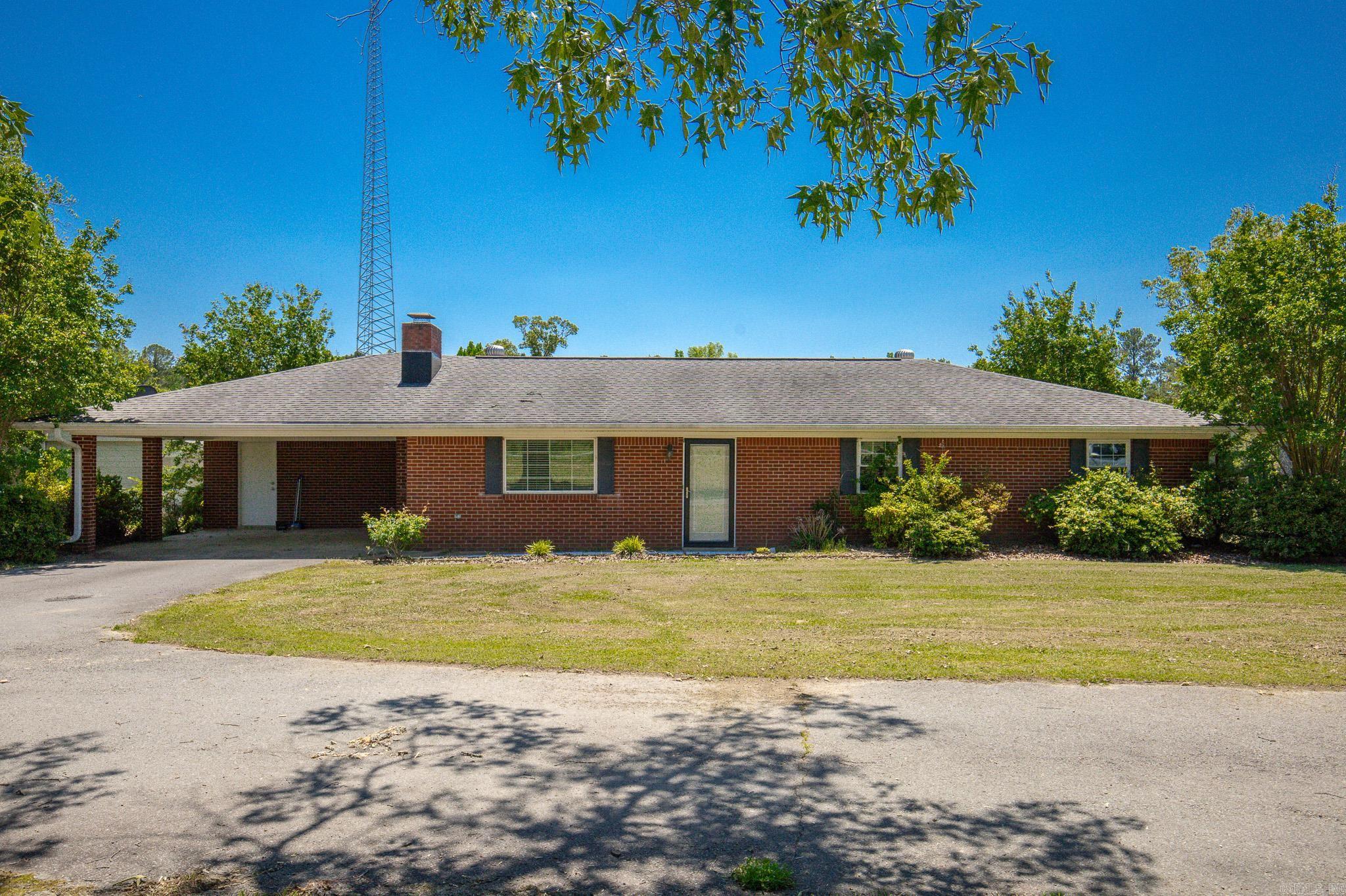 If you've been looking for a house with a large shop and acreage, look no further! This 3 bed 2 bath home sits on approximately 4.2 acres and has TWO shops!  Inside, enjoy a wood burning stove, an updated kitchen, extra large laundry room, and a heated and cooled enclosed sunroom.   Outside, you'll love the circle driveway, a 30x30 shop, and a huge 50x50 shop with plumbing and large bay doors that will fit large trucks. Schedule your showing today!