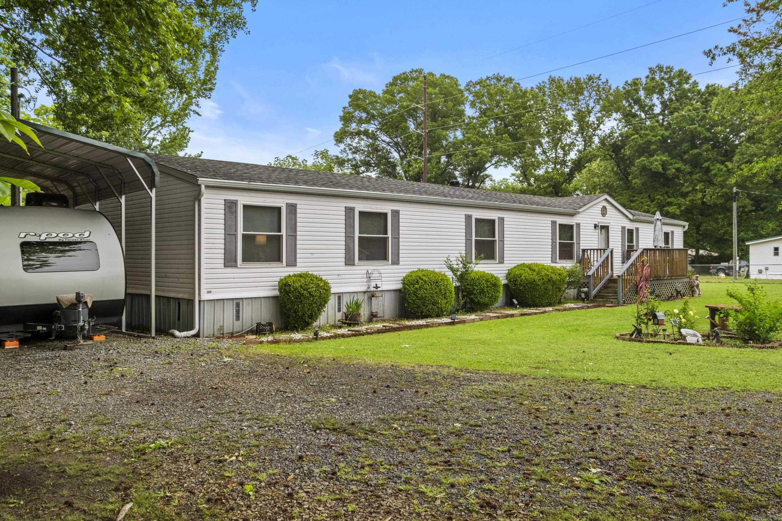 This 2,184 sq. ft. home offers 4 bedrooms and 2.5 bathrooms with a spacious, functional layout designed for comfortable everyday living.   Fully chain-link fenced 1 acre provides both security and flexibility, complete with an automatic gate at the entrance for added convenience. The manicured yard is meticulously cared for, offering plenty of room to relax. Need extra space? You’ll appreciate the 12x24 storage building equipped with electricity and a window A/C unit plus two other storage sheds—perfect for a workshop, hobby space, or additional storage. There’s also a large RV carport, ideal for protecting your camper, boat, or extra vehicles. Many more updates, this is a must see! Washer, Dryer and Refrigerator stay, and other furniture is negotiable with excepted offer. Roof-2019, HWH-2023, Air Handler replace-2026,HVAC-2023