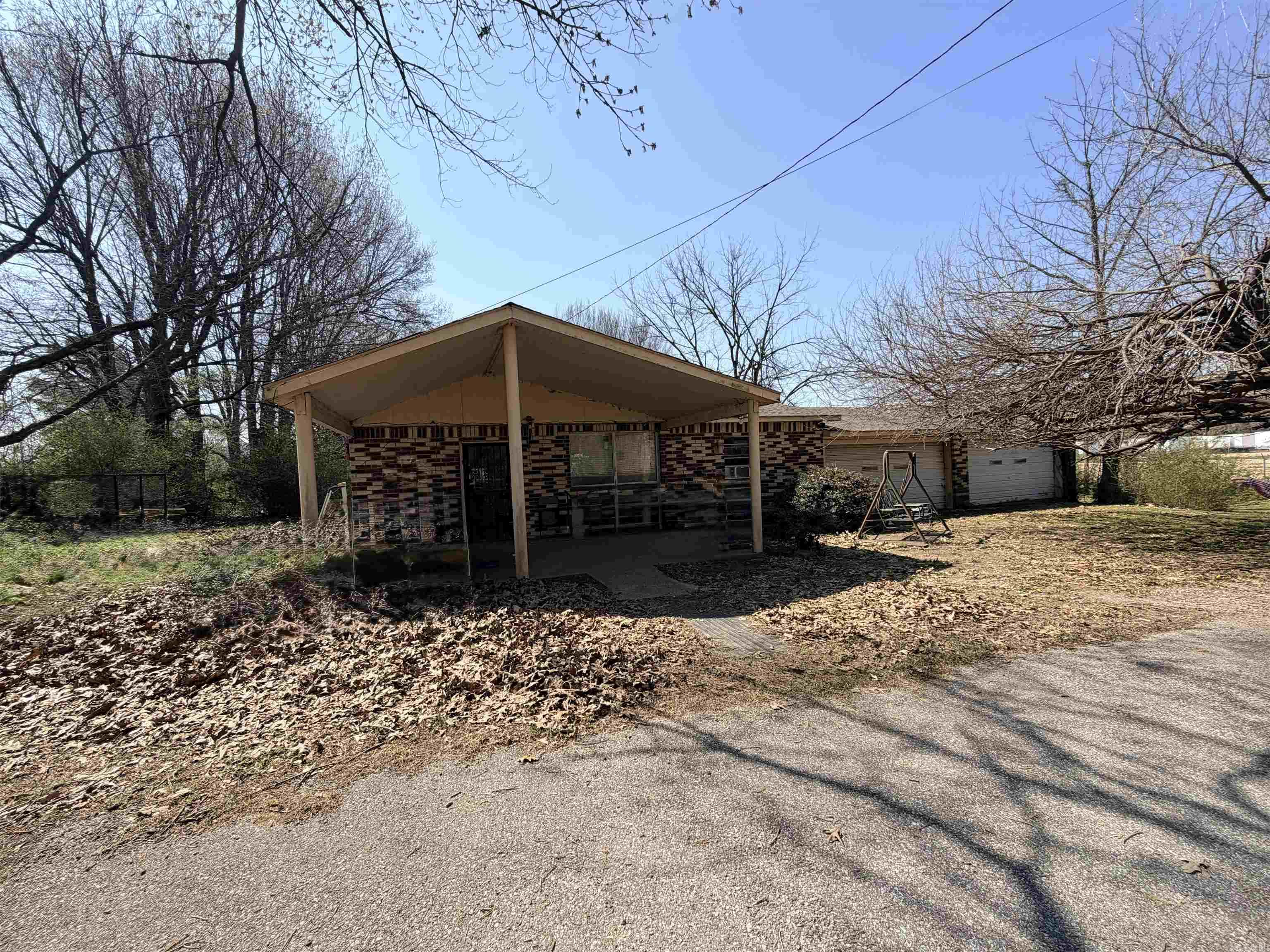 Unlock the possibilities with this 2-bedroom, 1-bath home full of potential! This property is a great opportunity for investors, flippers, or buyers looking to put their personal touch on a home.  Featuring a functional layout with a spacious living area, this home offers a solid foundation for renovation. The kitchen and bathroom are ready for updates, giving you the chance to design them to your taste. Both bedrooms offer good space and natural light, with room to reimagine and refresh.  Enjoy a large front porch—perfect for relaxing with your morning coffee or unwinding in the evening—adding charm and curb appeal to the home. Situated on an acre lot, the property provides plenty of outdoor space for improvements, expansion, or landscaping. With some TLC, this home could be transformed into a charming residence or a profitable investment.