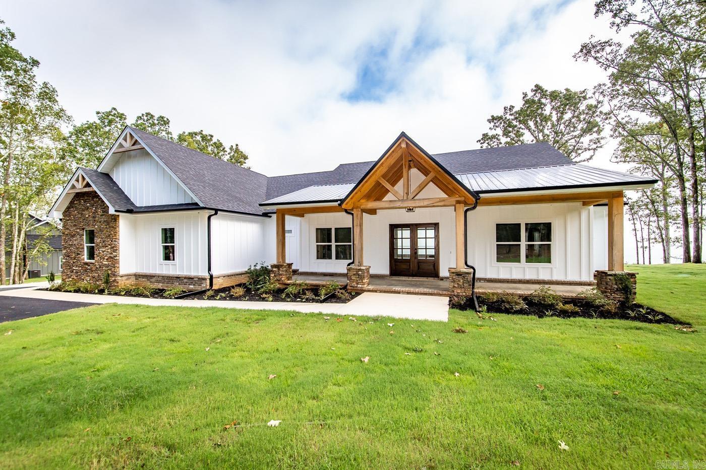 Brand New Home Built with some of the best views on Greers Ferry Lake nestled in the woods on 3 acres! Looks straight over "The Narrows" with panoramic views from Sugarloaf Island to Eden Isle.  Attached 2- car garage, convenient Built-ins in the laundry/mud room. Durable LVP flooring throughout the home w/granite countertops, Beautifully tiled master bathroom with large walk in closets, walk in shower & Soaker Tub. Kitchen has hot water option over stove top, built in wine rack & extra cabinet storage under the Breakfast Bar. Covered porches on the front & back of home. Walk in pantry off the kitchen, gas fireplace & all 4 bedrooms & 3.5 bathrooms on the same level. Located only approx. 8.1 miles to Lacey's marina and 2.2 miles to Lakefront Rd. Boat Ramp around the corner. New home, so taxes are TBD.