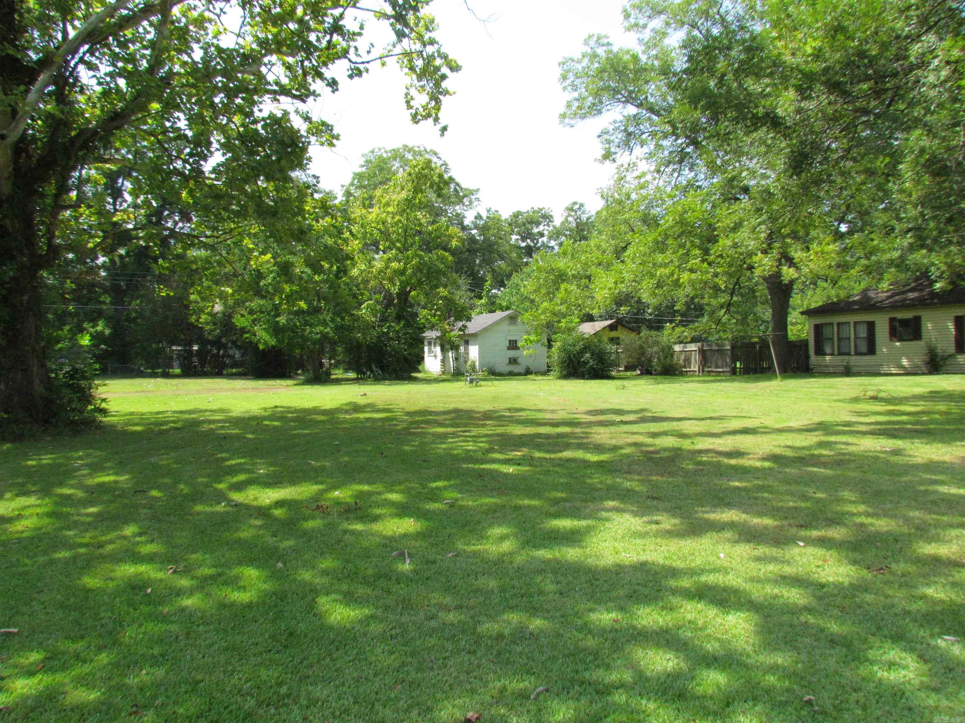Great investment, small rental house on property with large corner lot with utility connections for building a home.  Located close to shopping, City amenities, schools and Major Employment.  One you must see to know the possibilities for this property.
