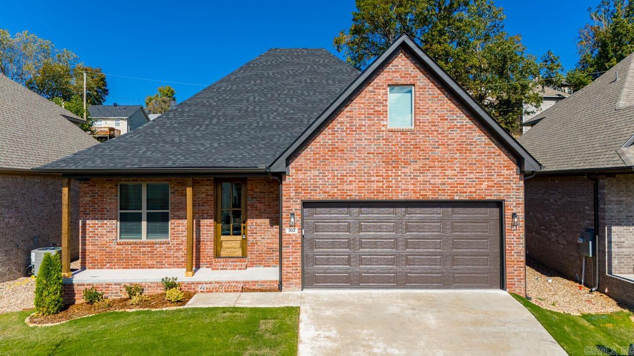 Move-in Ready.  West Little Rock Home is 2,020 sqft, 3 bed 2 1/2 bath 2 car garage. Features include 2 level open floor plan with simple elegant finishes throughout. Luxury plank flooring, custom cabinets, solid surface countertops, stainless appliances, gas slide-in range, gas log fireplace, built-in pantry and walk-in closets, tile master shower with covered back patio. Agent & Builder Owned.