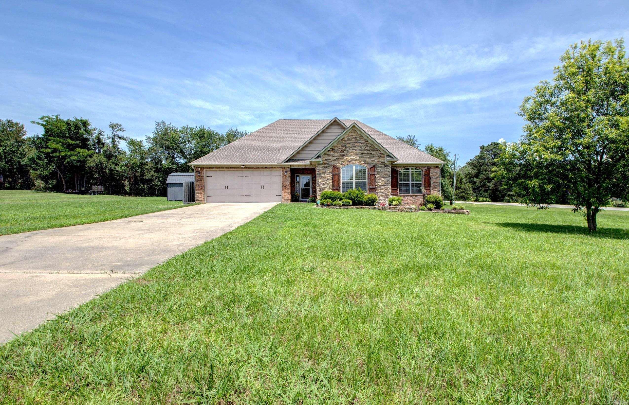 Welcome to 104 Bob White Cove!  Enjoy the perfect blend of peaceful country living and neighborhood convenience on just over an acre in the desirable Antioch area. Located just minutes from Beebe with easy interstate access, this beautiful home offers privacy, space, and charm. The inviting exterior features a carriage-style garage door, rustic shutters, an extra drive path to the back, and fresh landscaping that create outstanding curb appeal. Inside, you’ll find soaring ceilings, exquisite trim work, rustic-inspired fixtures, luxury vinyl plank flooring, and abundant natural light throughout. The kitchen is equipped with custom-stained cabinetry, Corian countertops, a walk-in pantry, and a cozy breakfast nook. Spacious bedrooms provide excellent closet space, while the primary suite features an oversized walk-in closet and an en-suite bath with double vanities. Step outside to a fully fenced backyard perfect for entertaining, relaxing, or enjoying the outdoors under the charming sundowner awning. A storage shed conveys with the property, offering additional space for tools and equipment. If you’re looking for character, comfort, and room to breathe, this home is a must-see!