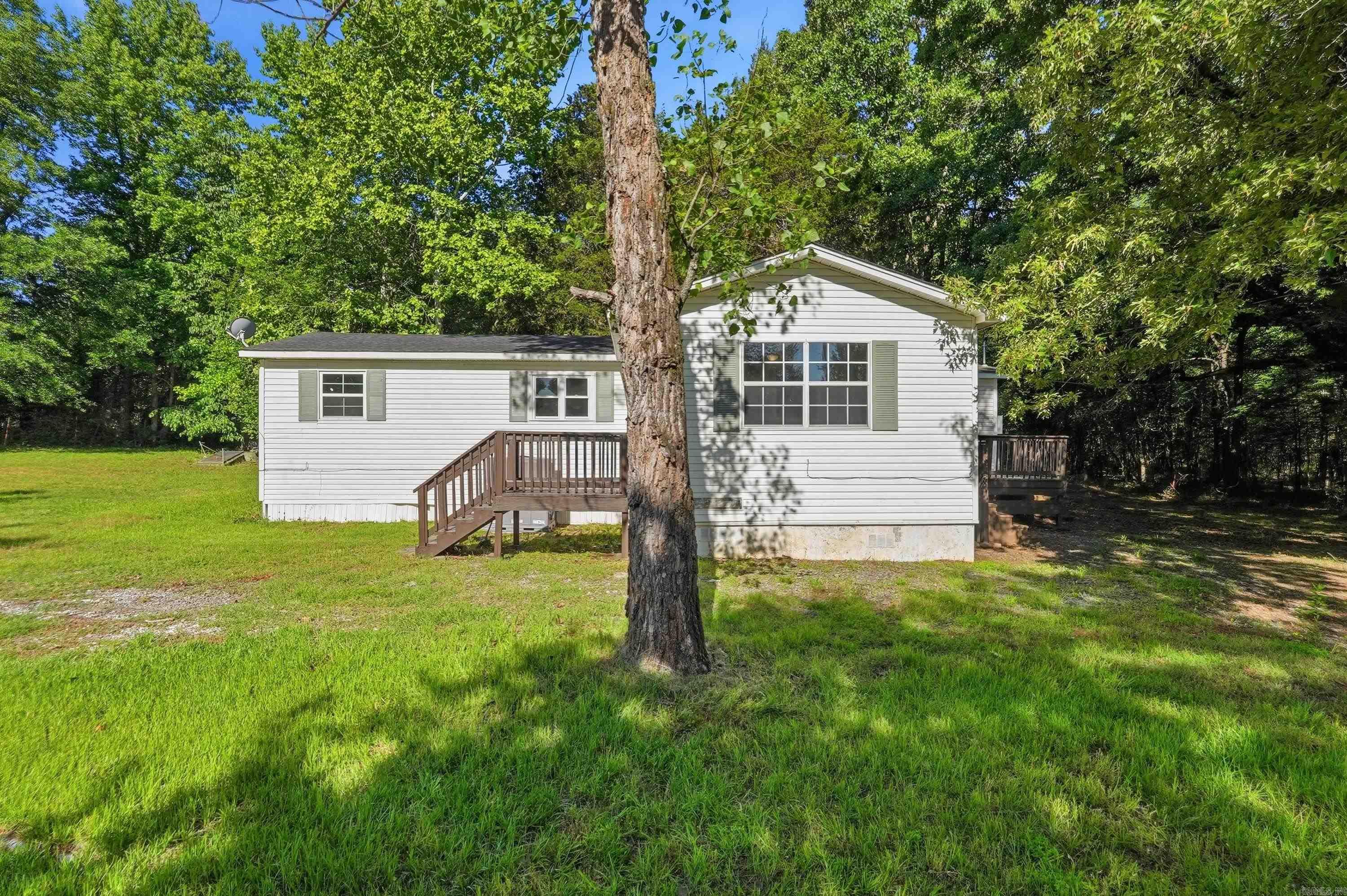 Don't miss this 3-bedroom, 2-bath home on one acre in the city limits with Conway Corp utilities, a large outdoor area with plenty of room for gardening or enjoying the peaceful surroundings, and still conveniently located near town. See agent remarks