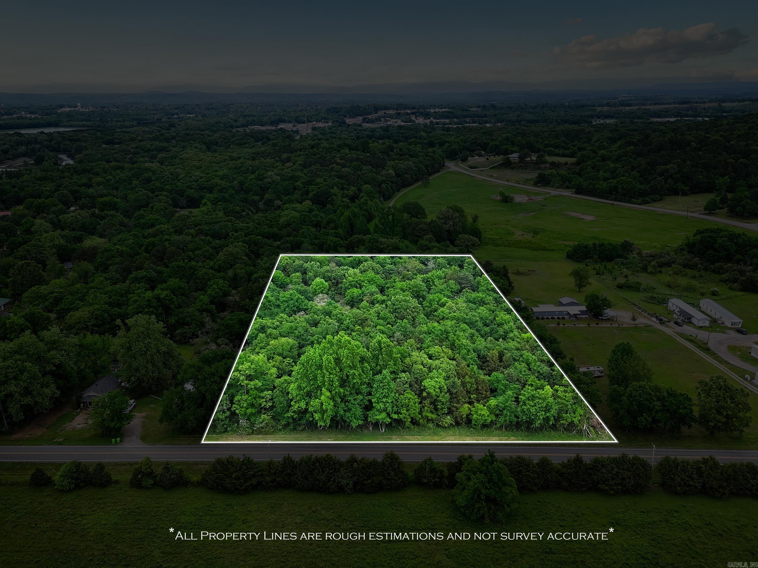Rare 4.5-acre wooded tract inside Clarksville city limits. Private, rolling terrain with mature hardwoods, ideal for a secluded custom home site, multi-home opportunity, or recreational retreat while remaining close to city amenities and schools. Property is close to Spadra park and Arkansas River. Easy access from a paved road; bring your builder.