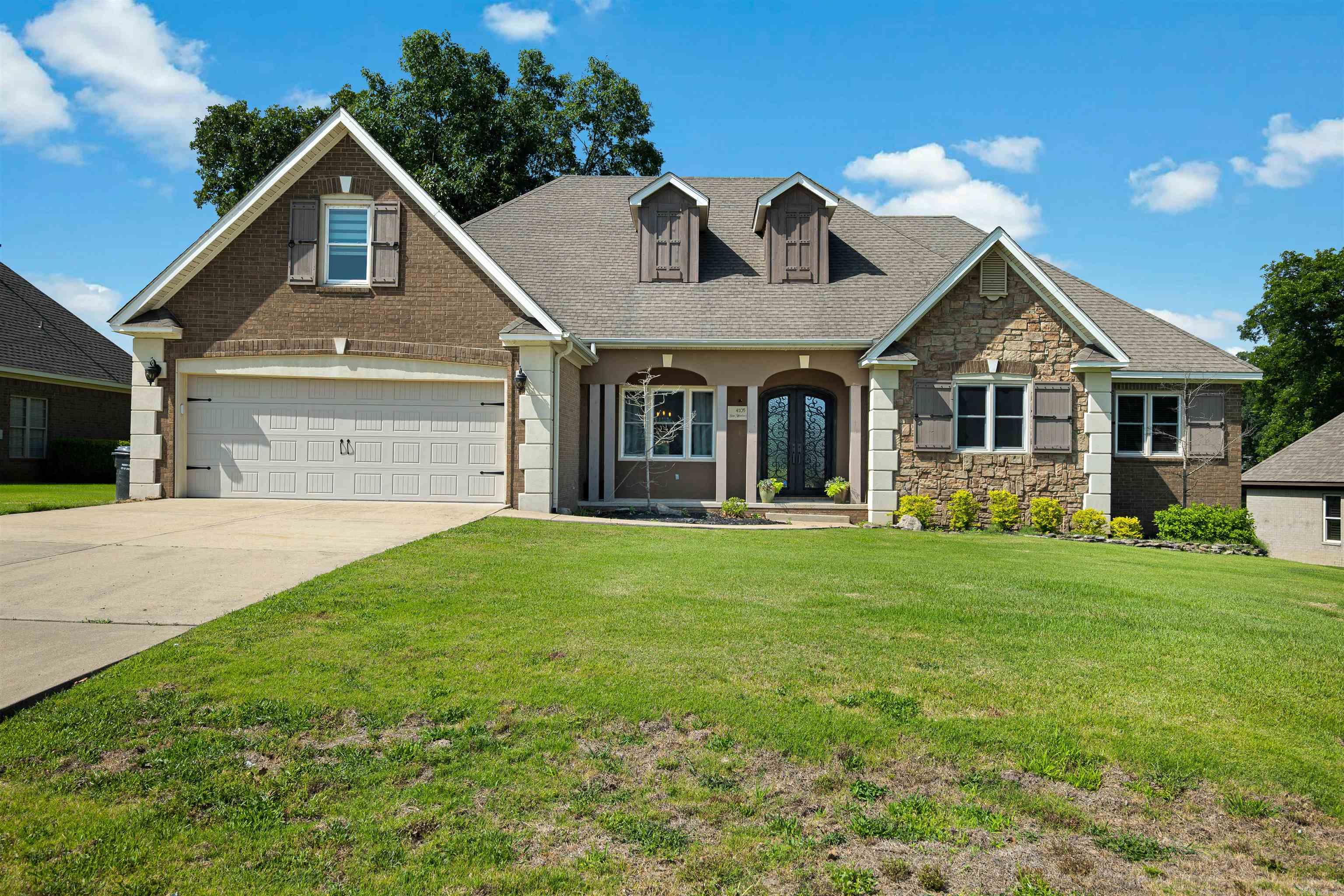 Welcome to the market 4105 Sage Meadows Blvd, Jonesboro, AR 72405,  a spectacular golf course property located on the 8th fairway in the highly desirable Sage Meadows community! This 2,907 +/- square foot custom built home is situated on a 0.31 +/- acre lot offering stunning views and is the perfect blend of comfort, style, and location. Three bedrooms located on the same side of the home with two full bathrooms, an extra half bath downstairs, and a bonus room upstairs, added in 2024, along with a half bath all with its own private entrance through the garage. Inside, you'll find spacious living areas, tile floors that look like hardwood, an inviting layout, and the abundance of tall windows allowing plenty of natural light throughout. Enjoy peaceful mornings and relaxing evenings overlooking the amazing views of the golf course from your own backyard. Conveniently located near everything Jonesboro has to offer. Whether you're an avid golfer or simply love scenic surroundings, this property delivers exceptional lifestyle and curb appeal in one of Jonesboro's premier neighborhoods. You will LOVE all this home has to offer! Call today to see this beauty!