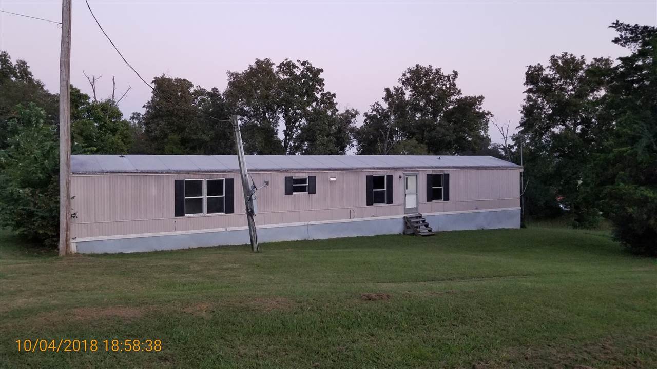 Large lot with view of pastures. This singlewide MH is the perfect starter home or investment property and has a barn. Sold as-is, where-is. Agents see remarks.