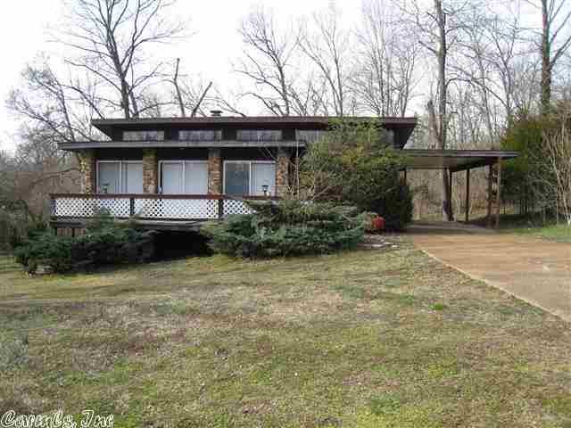 This Unique 2-BR/1-BA home features a beautiful Native Stone fireplace and beamed ceilings in living room.   Hardwood & tile flooring, CH/A & front deck.  Located just a few blocks from the SOUTH FORK RIVER, LAKES, GOLF COURSE AND TOWN CENTER. This property is now under auction terms.  All bids are to be submitted through www.auction.com.  This property is subject to a 5% buyer's premium pursuant to the Auction Terms & Conditions (minimums may apply).  Please contact listing agent for details.