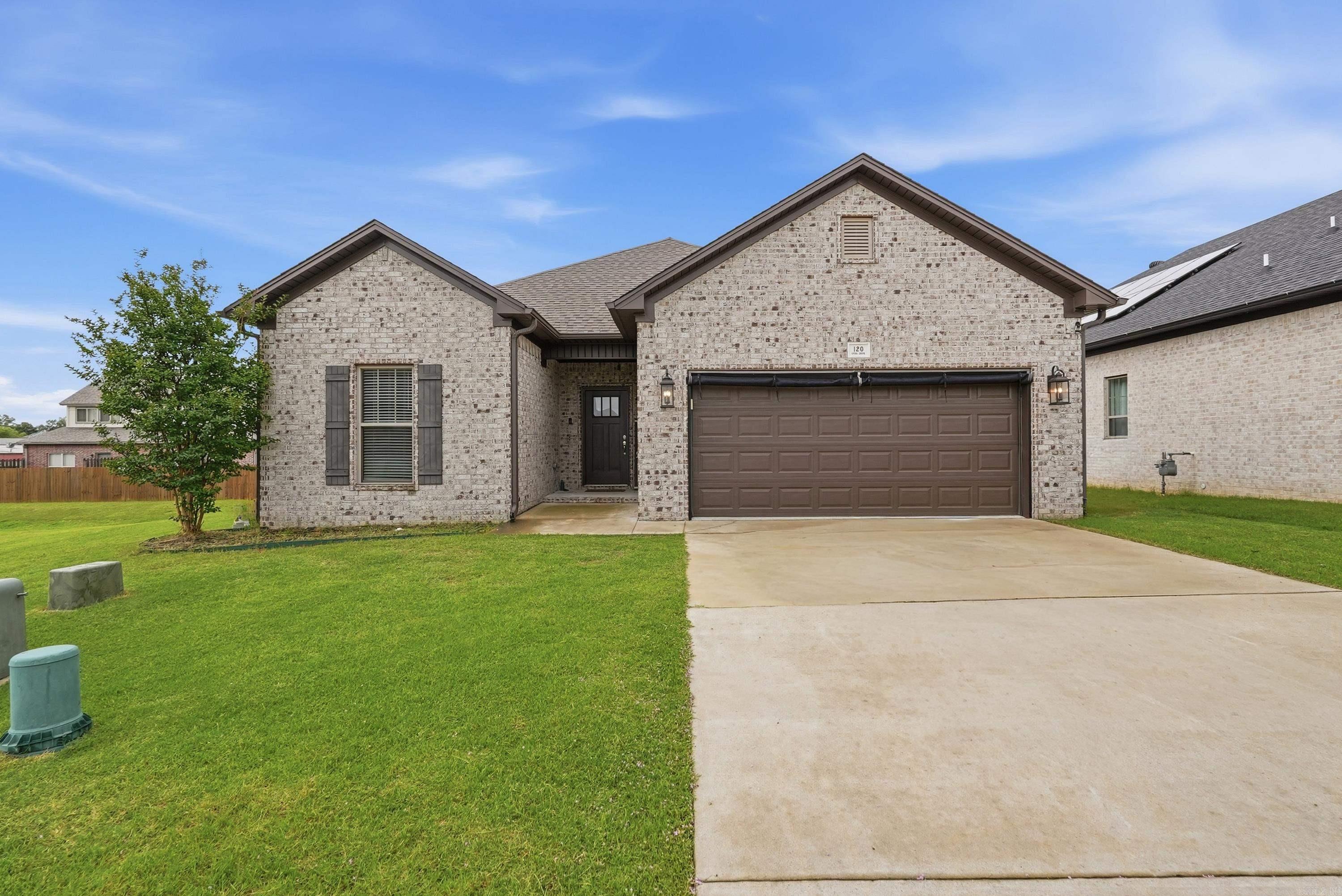 Beautiful 3-bedroom, 2-bath brick home tucked away at the end of a quiet cul-de-sac in the beautiful city of Maumelle! Built in 2021, this 1,848 SF home features quartz countertops, a gas range, crown molding throughout, a cozy gas fireplace, and tons of storage. The spacious primary suite includes a walk-in shower, while the screened-in back patio offers the perfect spot to relax year-round. Additional highlights include a laundry room, mudroom area, natural gas, underground utilities, gutters, and a location just minutes from parks, trails, shopping, and dining. Move-in ready and loaded with upgrades—don't miss your chance to call this Maumelle gem home! Agents, please see remarks for more info.