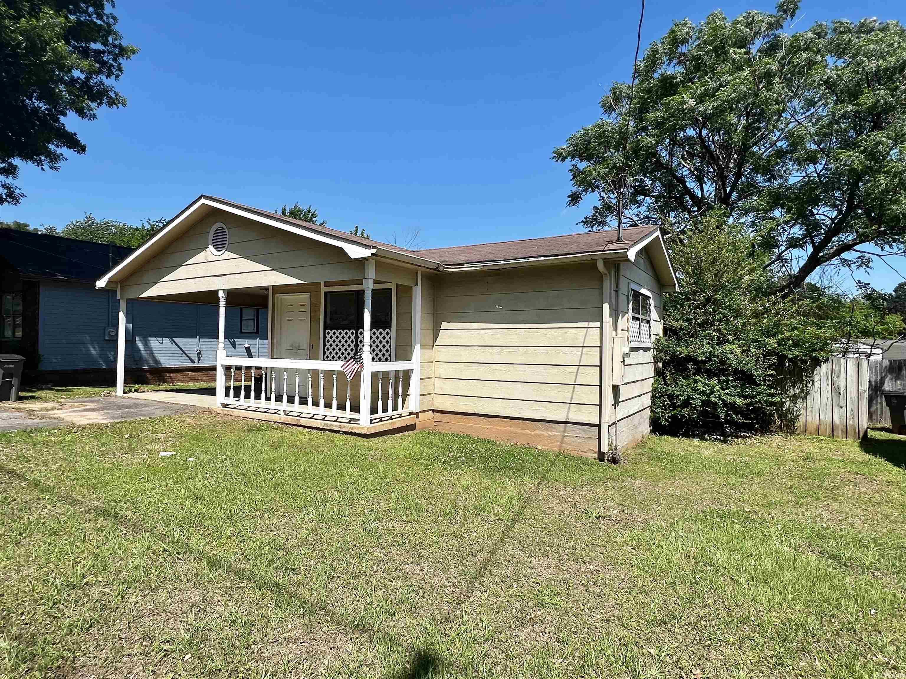 This home is in a prime location. Quiet neighborhood just minutes from shopping, hospitals, restaurants and schools.  Features nice sized living area and separate dining room.  Two good sized bedrooms with plenty of closet space.  Could make a great rental property or with a little work could be a charmer.  We have a lender that can do a renovation loan on this home.