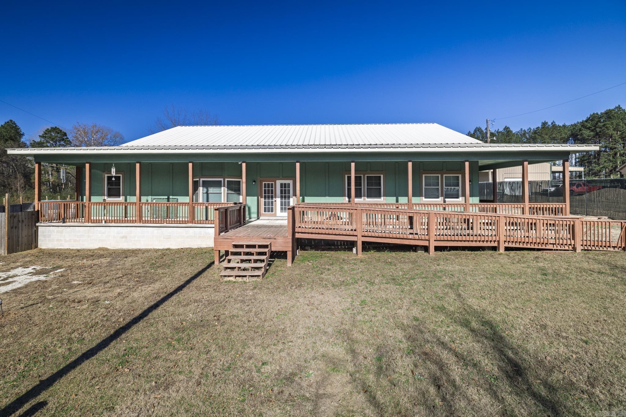Why wait months to build when you can move into a beautifully designed home that’s already finished? Built in 2020, this spacious home offers over 3,500 square feet of thoughtfully designed living space on 3.15 peaceful acres in the Ouachita School District.  From the moment you arrive, the inviting wraparound porch welcomes you home. Inside, you’ll find an open layout with generous living spaces, flexible bonus rooms perfect for a home office, hobby room, fitness area, or guest space, and quality finishes throughout. A whole-home generator, tankless water heater, extra spray foam insulation, and energy-efficient construction provide comfort and peace of mind year-round.  Whether you’re looking for room to grow, space to entertain, or simply a place to enjoy quiet country living without sacrificing modern conveniences, this property delivers. Imagine relaxing on the porch with your morning coffee, watching the sunset over your acreage, and enjoying the lifestyle you’ve been dreaming about.  Move-in ready, thoughtfully built, and offering exceptional value—this is one you won’t want to miss. Schedule your private showing today!