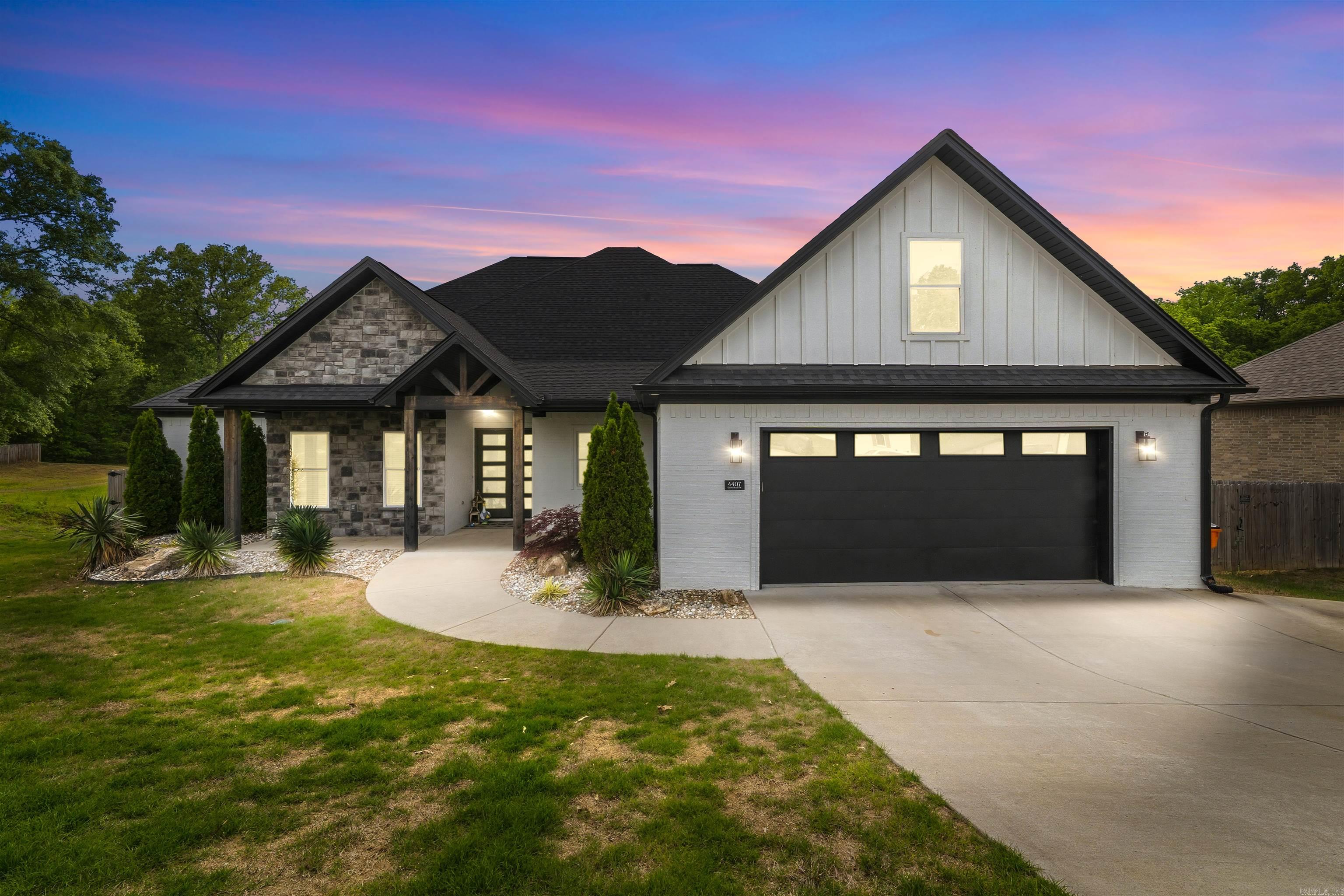 Step into refined living with this beautifully designed home set on 1.21 acres, where luxury meets functionality. Flooded with natural light, the open-concept layout features wood-look tile in the main living areas, wet areas, and primary suite, anchored by a stunning living room with soaring vaulted ceilings. Kitchen has an 11-ft island with built-in storage, soft-close cabinetry and drawers, plus dedicated spice and utensil storage, perfect for both entertaining and everyday living. Just off the main space, a dedicated office or potential 5th bedroom offers privacy and versatility. Retreat to the primary suite, complete with a spa-inspired bathroom featuring a luxurious pass-through shower, a striking stone wall behind the soaking tub, and a custom closet with built-in dressers and vanity. Guest bedrooms each offer walk-in closets for extra comfort. Additional highlights include an oversized garage with dual storage closets, a huge laundry and mud room, and abundant storage throughout. Enjoy peaceful outdoor living on the large vaulted back porch with a fireplace, overlooking gorgeous green space and direct creek access. Extra parking pad to the right just added for convenience!