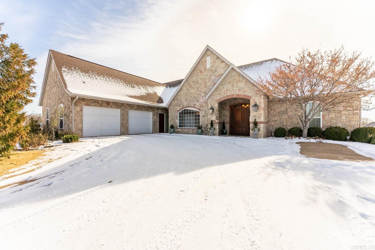 Welcome to your dream home at Big Creek Golf and Country Club, where luxury living takes center stage. This stunning 3-bedroom, 2 1/2-bathroom residence spans an expansive 3,595 square feet. The gourmet kitchen, complete with a 6-burner gas cooktop, double ovens, and a walk-in butler pantry, is a chef's delight. Entertain effortlessly with the wet bar, ice machine, and beverage cooler. Step outside to the covered patio, featuring an outdoor kitchen with a ceramic cooker and Wolf gas grill, perfect for hosting gatherings. The master suite offers a custom spa area with an endless pool, exercise area, sauna, and garden tub. Don't miss out on this incredible opportunity to make this home yours. Call us today to schedule your private showing!