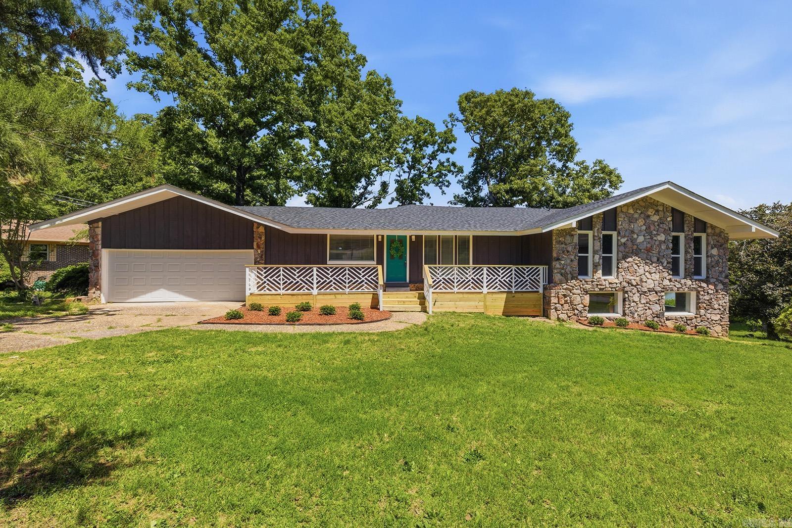 Welcome to your lakefront home with private lake access and your very own fishing spot Relax on your front or back porch. NEW: roof, HVAC, kitchen & bathroom cabinets., interior and exterior paint & flooring. Corner lot provides expanded lake frontage and multiple outdoor spaces, including an open deck with great views and a screened porch area to enjoy bug-free evenings. Close to city amenities while still offering peaceful lake living. Cozy up to the fireplace and still see the lake, with large windows across the back of the den. The primary suite offers lake views and a walk in closet. If your family needs a split floor plan, this home also has that option. Full bath, bedroom and bonus area downstairs. Large indoor storage closet. Schedule your private showing today. *See agent remarks*