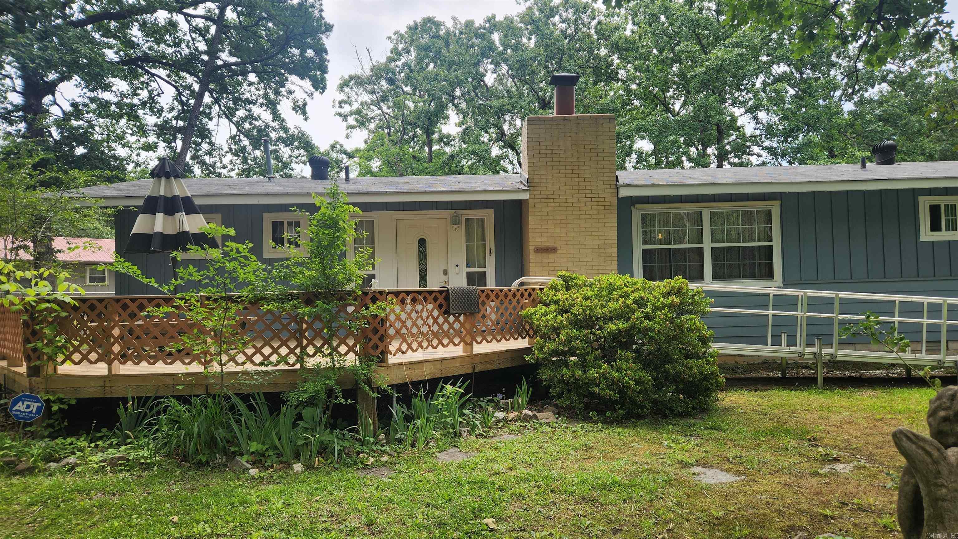 1420 sq ft home just minutes from Lake Ouachita. This is a 2 bedroom (could be 3) 2 bath. Washer/dryer/refrigerator/electric cookstove included. Living room/kitchen area are spacious and open. One bath has a walk-in tub and the other has a stand up shower. 10x18 wooden deck. Attached carport. 24x24 garage with concrete floor. 24x32 "boat shed" that has security boards all the way around. Dog pen. CHA along with wood burning fireplace (cleaned and inspected). City water but also has a well. All of this sitting on 1 very low maintenance acre. If you are looking for something close to the lake or not far from town, this may be your spot.