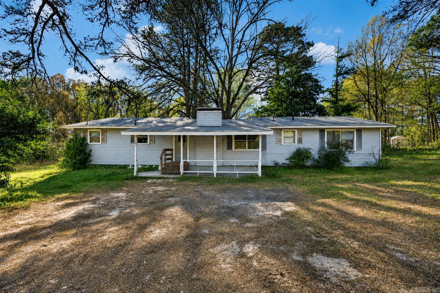 Welcome to 603 Mt Zion Rd in Arkadelphia—a charming home nestled on 2 peaceful acres offering the perfect blend of comfort and space. This property features fresh updates throughout, including stylish flooring, neutral paint, and refreshed fixtures that create a move-in ready feel. The spacious living area provides plenty of room to relax or entertain, while large windows bring in natural light and showcase the surrounding property. The kitchen offers ample cabinet space and functionality, ready for everyday living or future personalization. Generously sized bedrooms provide comfort and flexibility, and both bathrooms have been updated for a clean, modern look. Outside, enjoy the privacy and possibilities of 2 acres—ideal for outdoor living, gardening, or simply enjoying the quiet setting. Whether you're looking for a primary residence or an investment opportunity, this property offers value, space, and potential just minutes from town.
