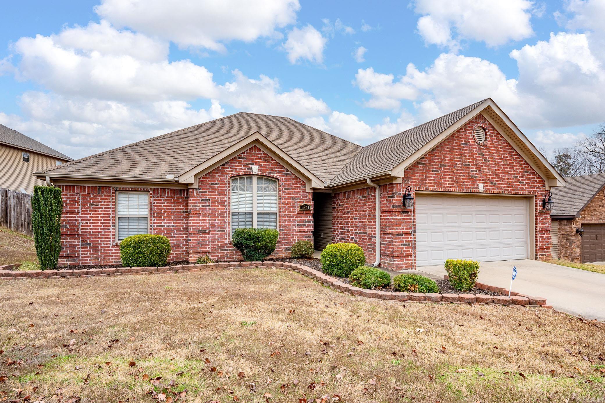 Phenomenally updated and maintained home in family friendly Carrington Place subdivision. Fantastic home to entertain and comfortable floor plan! All solid surface flooring for easy cleanup from the kids and fur babies. Big roomy great room. Semi-open layout from the great room to the fully updated kitchen / dining combo. Updated with quartz countertops and stainless appliances. Large ensuite primary features his & her's walk-in closets, double vanity, jetted soaker tub, and walk-in shower. Beautiful tray ceilings in primary and great room and electric fireplace for ambiance. Fully fenced backyard with large covered patio for grilling and relaxing. Zoned for Bryant schools - all high scoring and located within 4 miles.
