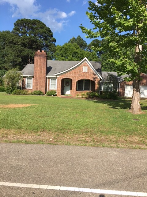 lovely 3 bedroom, 3 1/2 bath older home. Hardwood floors updated kitchen, has formal L.R. D.R. and extra room for office, or craft room. Central Heat and Air over 2400 sq ft. Lawn beautifully landscaped, has extra storage with a 3 bay building, a barn, and much more. Approximately 10 acres with a small pond Another 2 bdroom 1 bath home is located on the property ..This house is a must to see.   Call Today...