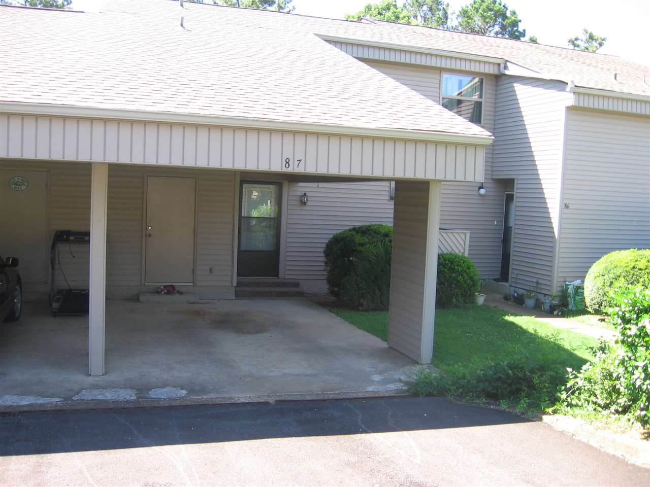 AS IS. Nice condo with carport.  2 BR, 1.5  Ba, open living/dining combo, plus updated kitchen, & nice appliances included. A 10' X 24' room is added on the rear, views of wooded area, & H/C with stand-alone unit.  Great extra living space! New steps down to a shop & storage area.  Extra attic storage & under stairwell.  Very comfortable.  Very good value.  Very easy living.  Very convenient to everything.   All close to private complex pool, Health Club, restaurants, park, shopping, etc.  Selling AS IS