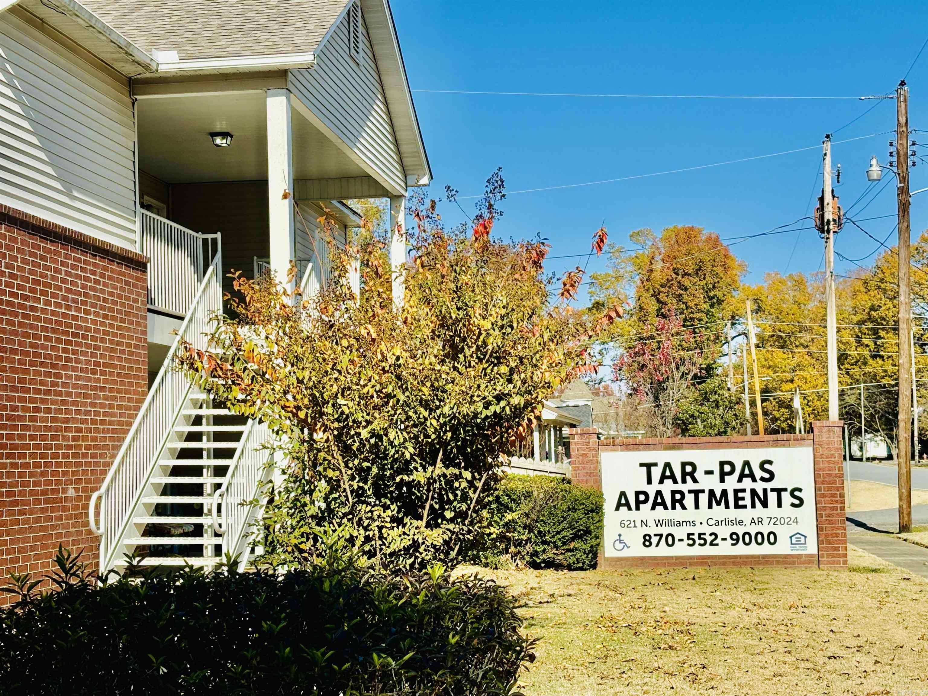 RARE OPPORTUNITY:  23-unit apartment complex that is fully occupied located in Carlisle, Arkansas.  This property has been loved and nurtured by the same family for years!  2 bed/2 bath, refrigerator, washer and dryer furnished.  Water is paid by the owners.  Common area includes a living area, kitchen and restroom that can be used by tenants.  Several covered patios.  Property is located in the heart of town within walking distance to the park, downtown, banks, shopping and the library. 8 blocks from the elementary school, grocery shopping.  4 handicap accessible units, 2 wheelchair accessible, 2 parking spaces per unit.  12 units up. Each unit is 899 sq. ft.  Quiet living with clean well maintained grounds. New roof summer of 2022, 11 new HVAC units.  Easy 30 minute commute to North Little Rock/Little Rock.  Great investment opportunity that won't last long.  RENTS GOING TO $875.00 NOVEMBER 1ST, 2025 FOR ALL UNITS!!
