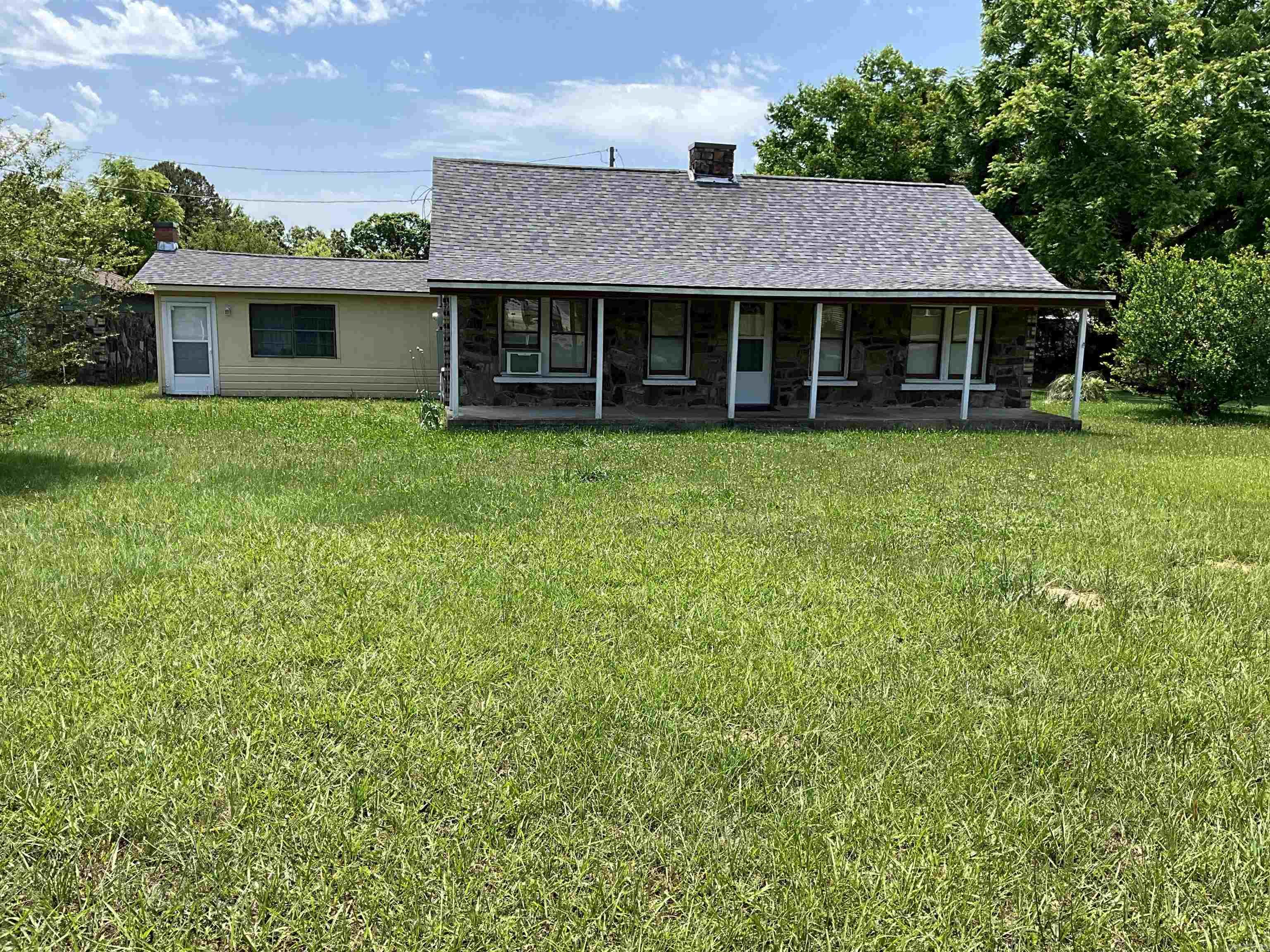 Stunningly remodeled rock home near Mena!This 3BR/2BA gem offers a peaceful country atmosphere with a large downstairs bonus room and an additional upstairs loft. Outside, find a detached 1-car garage with concrete floors, perfect for a hobbyist. Relax and unwind on the expansive front porch. A perfect retreat!