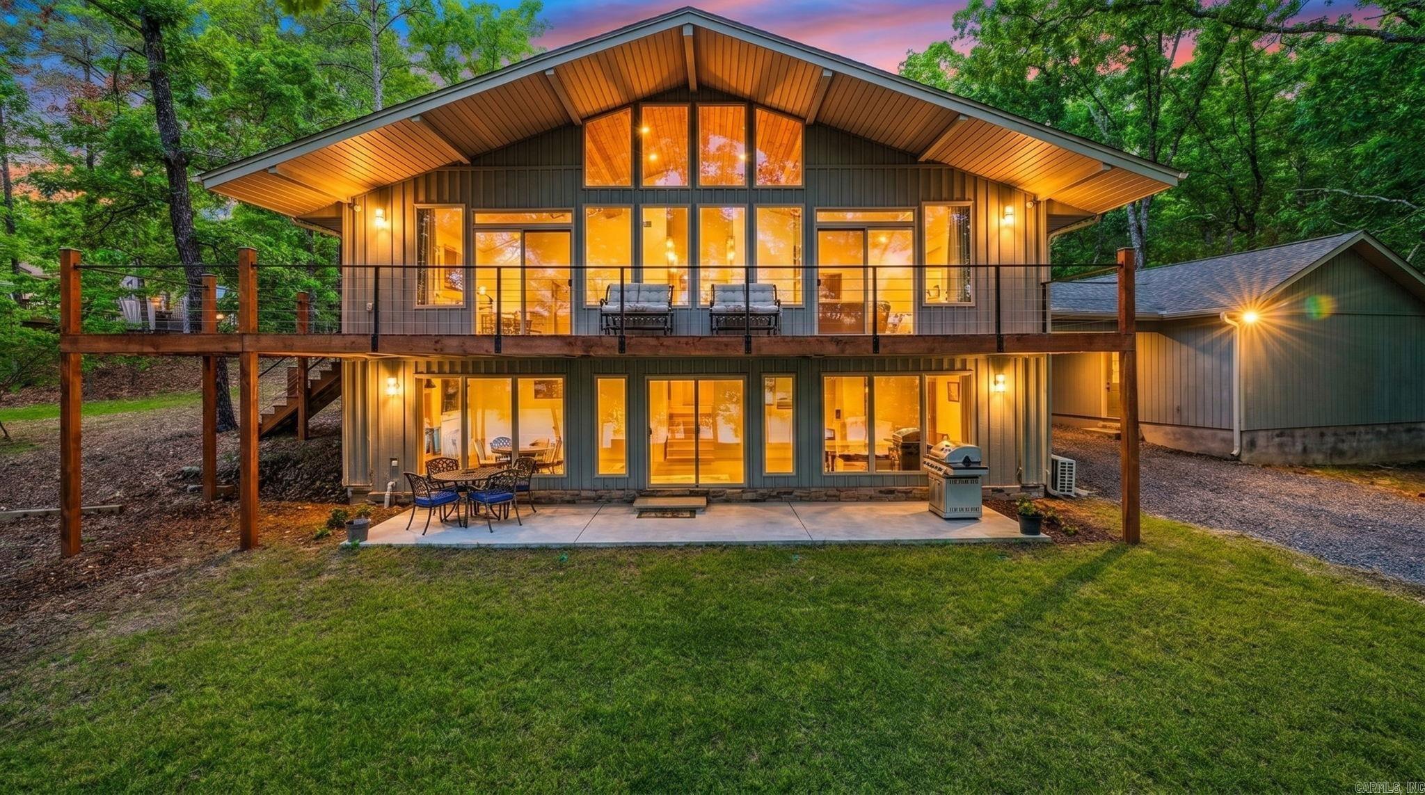 LAKE FRONT, LAKE VIEW with Property Line in GREERS FERRY LAKE and located in Fairfield Bay, but with no FFB dues or restrictions. This is truly a rare gem that has been striped to the framing a rebuilt with all new everything. The location on the lake is fantastic with an easy walk to the water and within kayak distance of Sugar Loaf Mountain and watch the FFB Fireworks from the water just outside the cove. with 5 bedrooms, 3 bathrooms, a full kitchen & living on one level and a kitchenette and 2nd living area on the other level, this could accommodate a large group/family for personal use or a short-term rental. Don't miss this opportunity.