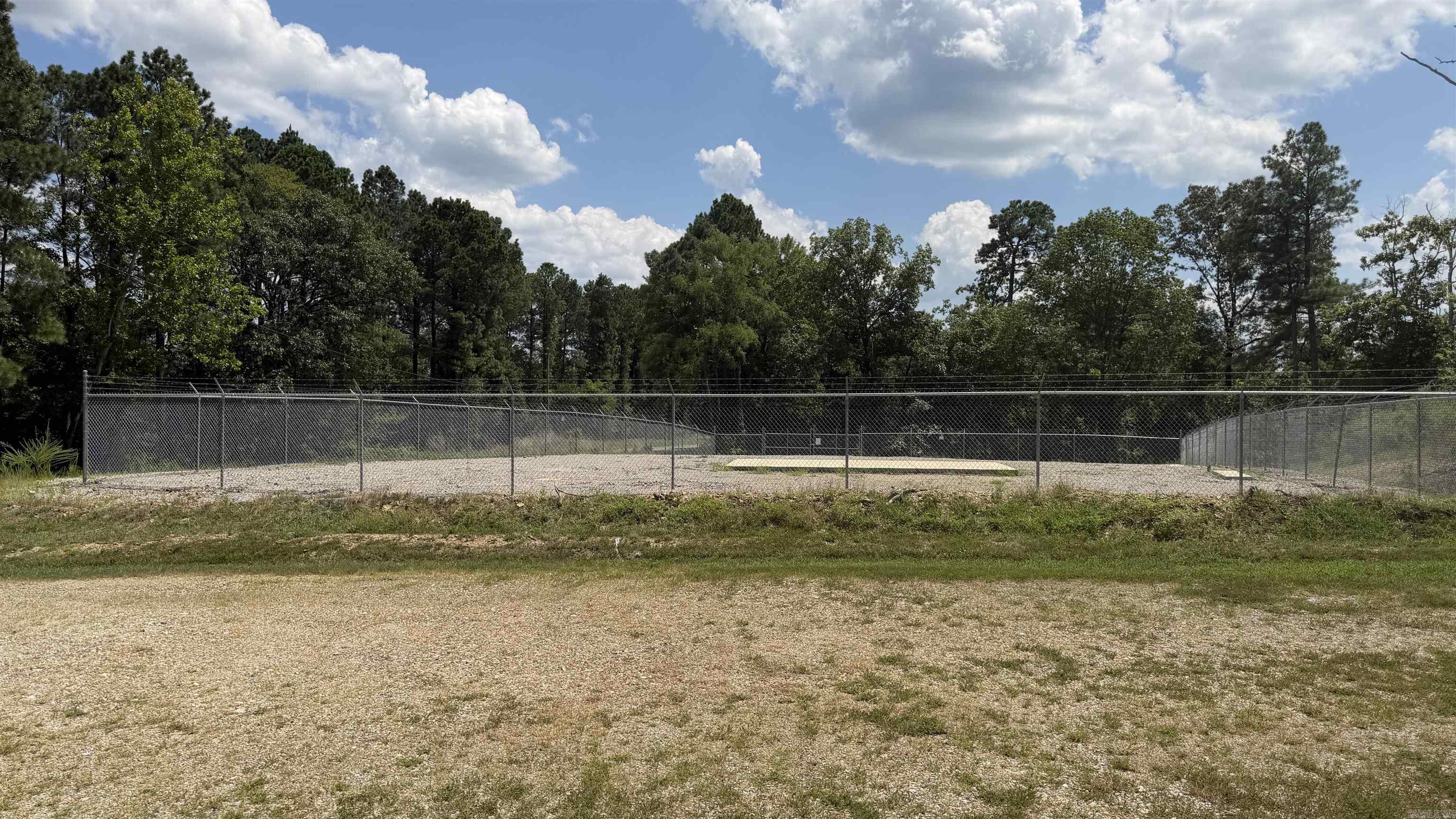 facing Sunshine Rd Level lot purchased and improved for future fiber optic site. Concrete pad. Utilities at the road. Zoned Commercial Misc Improved.Next to a church. Fully fenced. 2 concrete pads 2'x8' and 12'x24'. Firm on listing price