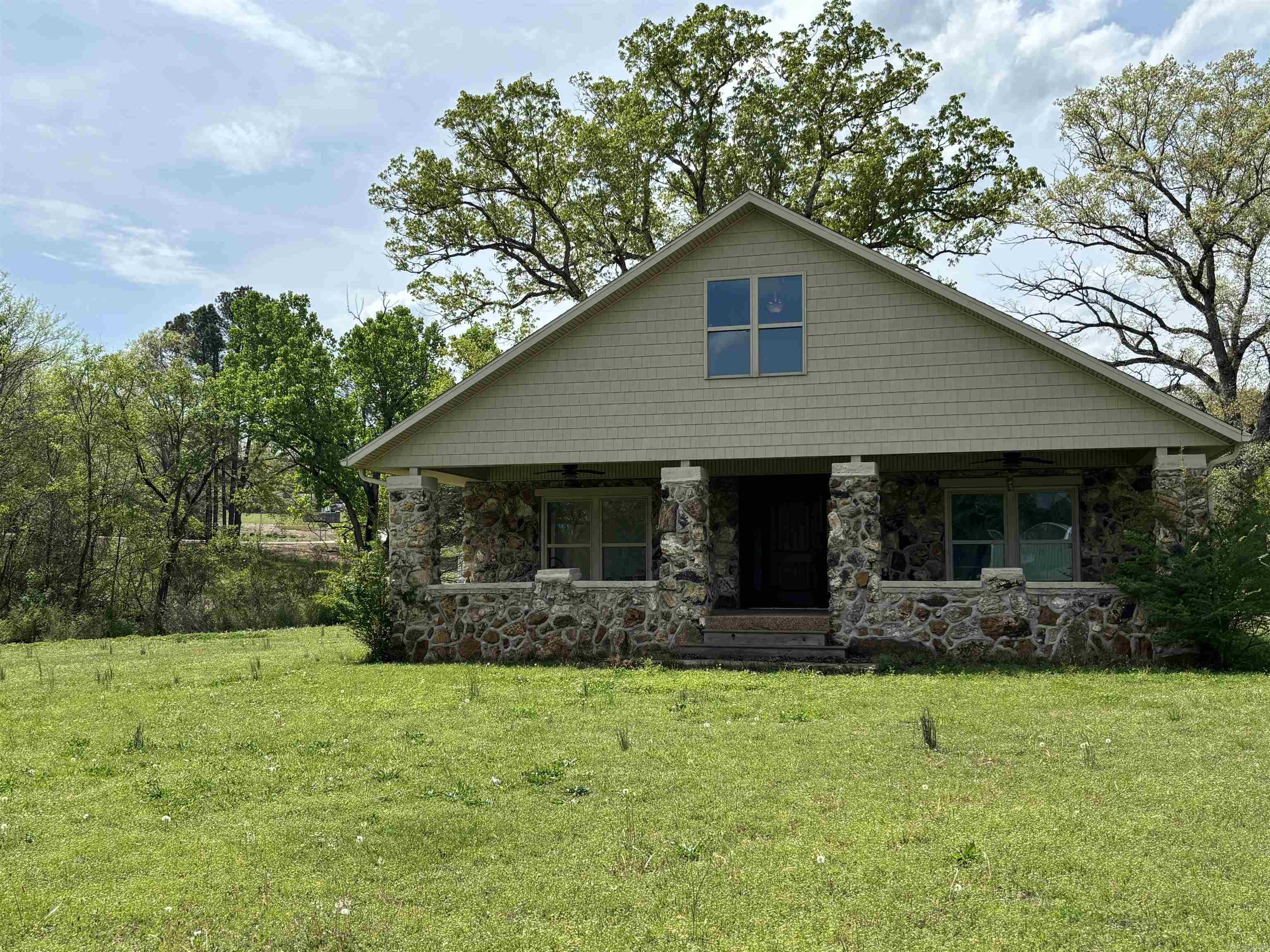 Discover the perfect blend of history and modern living in this beautifully remodeled cobblestone home! Nestled on approximately 3 acres with a picturesque creek running through the property, this unique residence offers tranquility and comfort. This home maintains its original historic character outside and features contemporary updates inside. The spacious and thoughtfully designed layout has 3 bedrooms, a bonus room, and two and one half bathrooms. The open concept makes entertaining easy and fun. With 1741 square feet of living space this home offers plenty of room for the entire family. The bonus room is the perfect space for an office, playroom, craft room, or additional storage. The large covered front porch, with a beautiful scenic view, is the perfect place to relax and enjoy nature. Call today for your private showing!