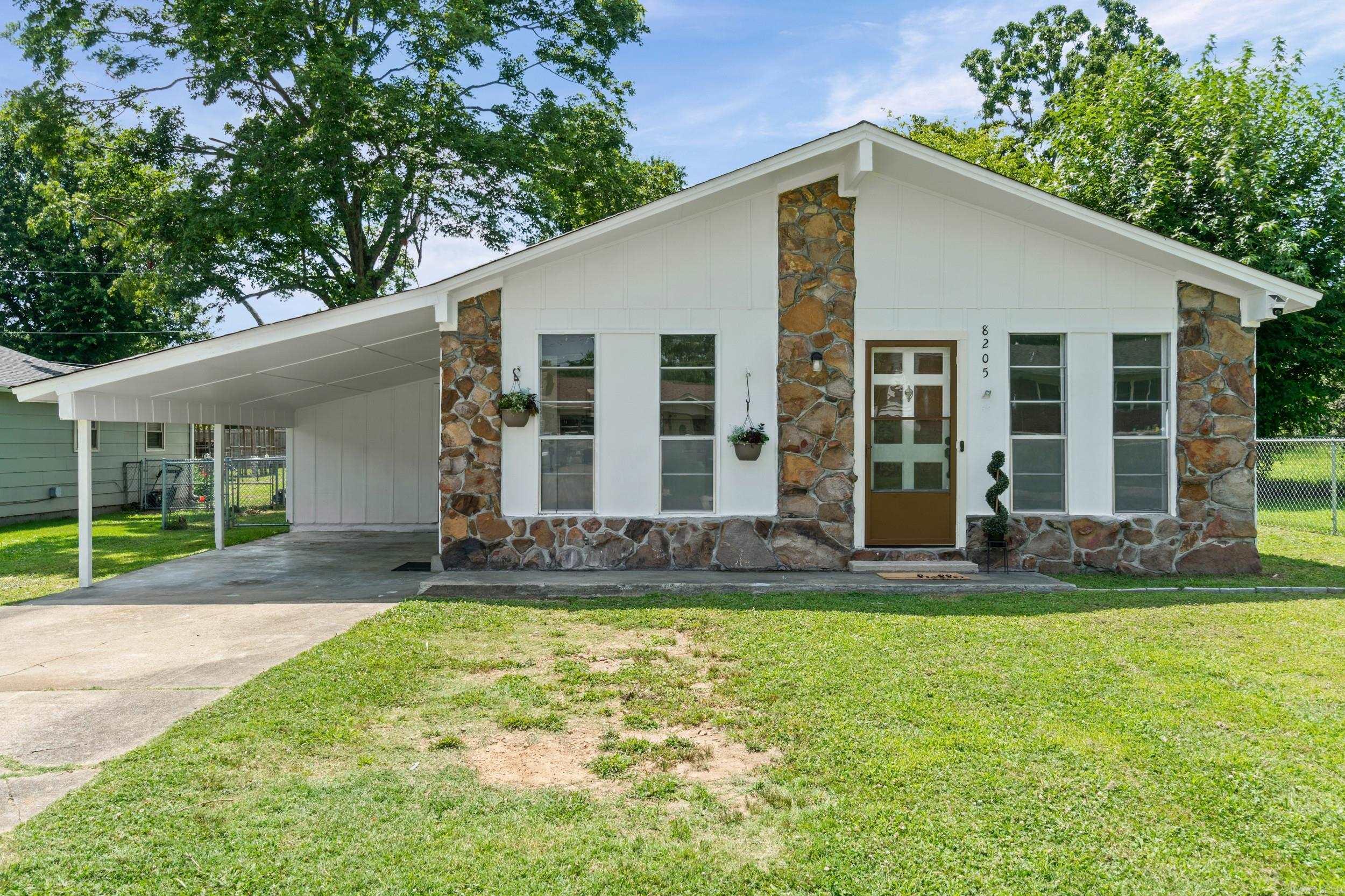 Redo, Upgraded, Like New, smells fresh and ready for a new homeowner. Very clean updates: fresh paint interior and exterior, new  kitchen appliances, cabinets, light fixtures, LVP flooring throughout house. NO CARPET. Bathroom tub/shower insert within a couple of years. HVAC and ROOF 2024. Charming rock and frame, carport with storage and laundry room. Completed fenced (Chain link) backyard, all flat easy to mow and care for. New fans and light fixtures throughout.  Large lot next door belongs to house on the other side so no neighbors on one side. Quite and peaceful neighborhood so convenient to all Shopping, freeway, schools local medical clinics. Perfect house for first time buyer, downsizing, retired or just someone wanting a new home in a great neighborhood. Sq ft approx, feel free to measure. NO Seller disclosure available