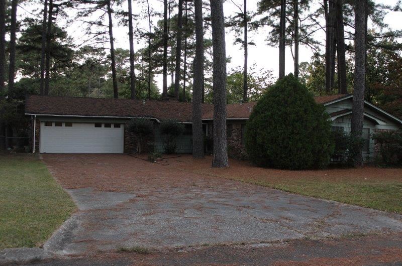 Brick home sits on a tree covered lot, Located on Robinhood Lane, features  4BRM, 2.5 baths, large living room area /dining combo. Brick fireplace with a cozy gas log insert.  Kitchen offers plenty of cabinets with a breakfast bar, laundry room, 2 car garage with remote controlled garage door.Patio in the back for relaxing, big back yard that is fenced with chain-link fence  Approx.2028 sq ft home priced to sell  at $65,000.00